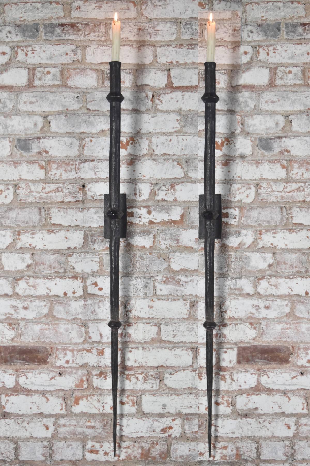 Large, hand-forged wrought iron wall sconces, timeless, bold and stark appearance, exclusively designed for the Fortress, each sconce is individually hand-forged by local artisans; small variations in texture and size are a natural feature.
Tapered