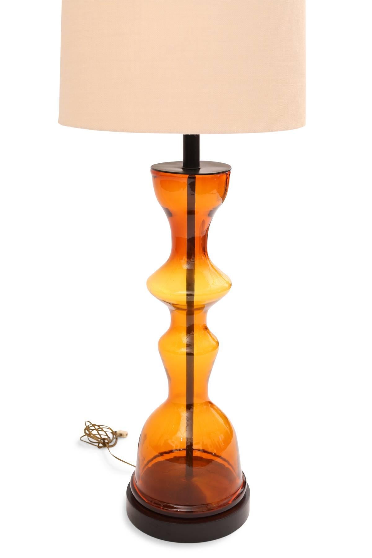 Wayne Husted for Blenko blown glass table lamp, circa late 1960s. This large-scale example has hues of yellows oranges and reds within an incredibly sculptural form.