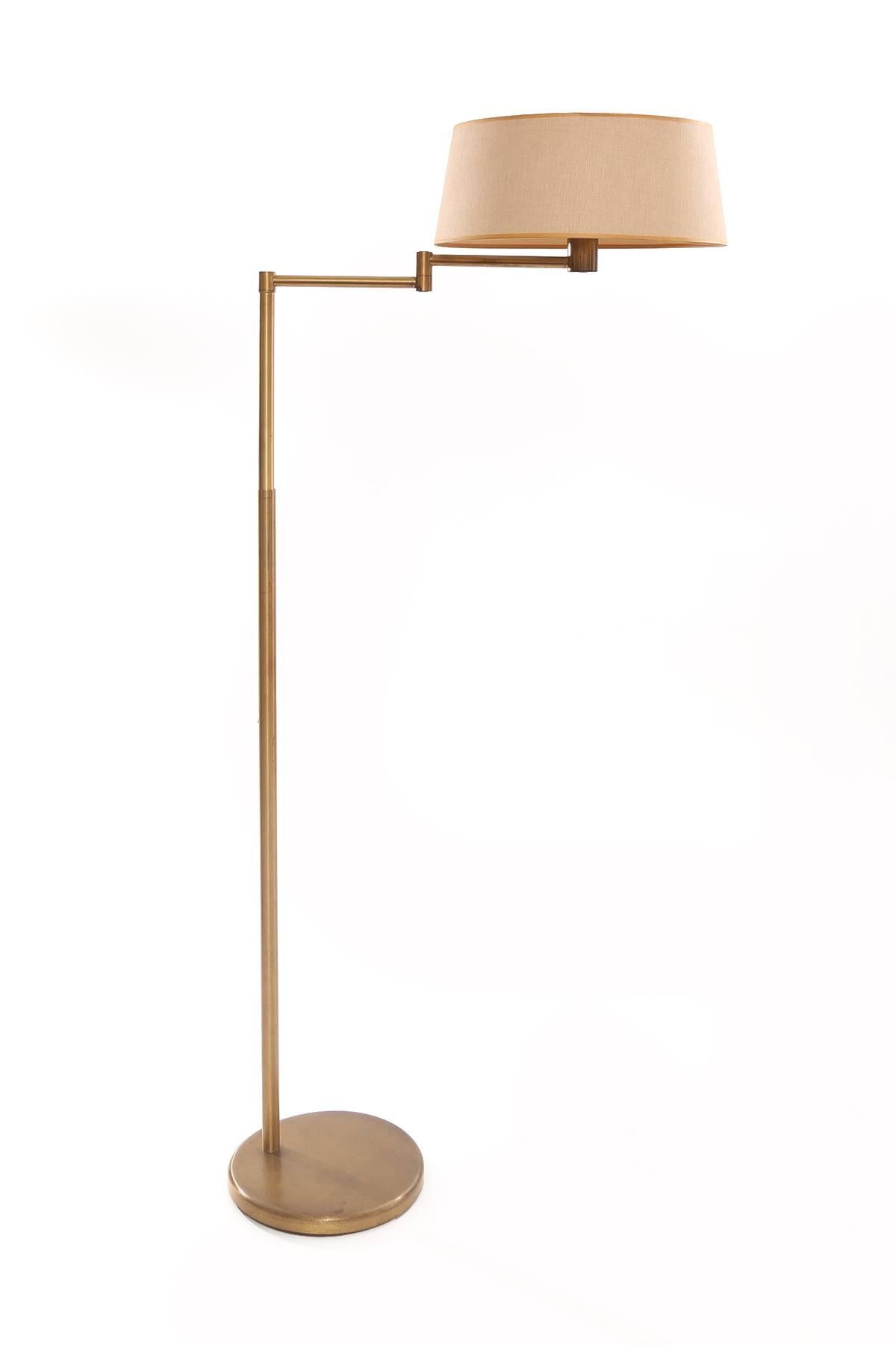 Von Nessen bronze floor lamp circa early 1960s. This example has a swing arm and its height is adjustable from 48
