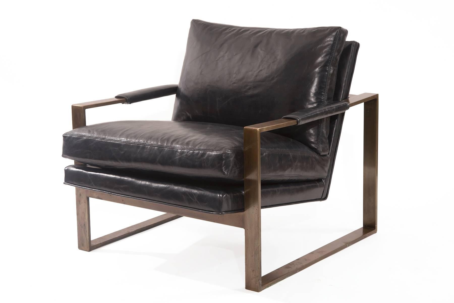 Bronze and leather lounge chair by Milo Baughman for Thayer Coggin, circa early 1970s. This lovely example has a patinated bronze frame and has been newly upholstered in a stunning down filled navy leather. Extremely comfortable.