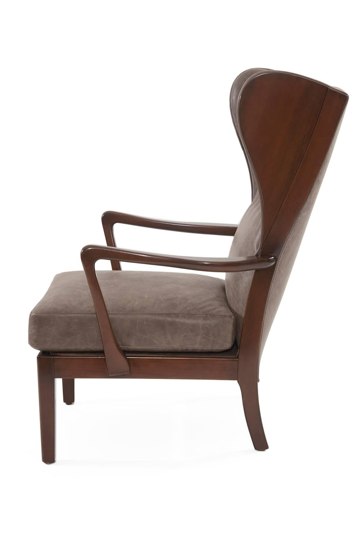 Remarkable Scandinavian wingback lounge chair, circa late 1950s. This example has a newly finished solid maple frame and has been beautifully upholstered in a perfectly broken in cocoa leather.