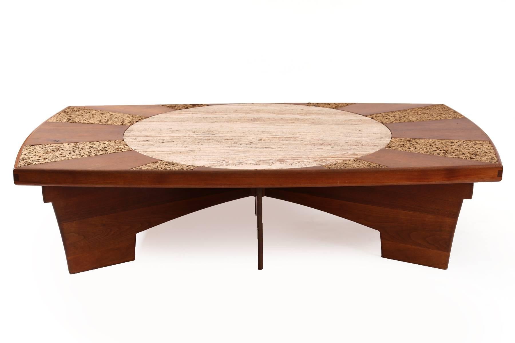 Large-scale custom walnut limestone and cork cocktail table, circa mid-1960s. This phenomenal example has sculptural solid walnut legs banding and top with alternating inset cork. The center is a beautifully grained limestone.