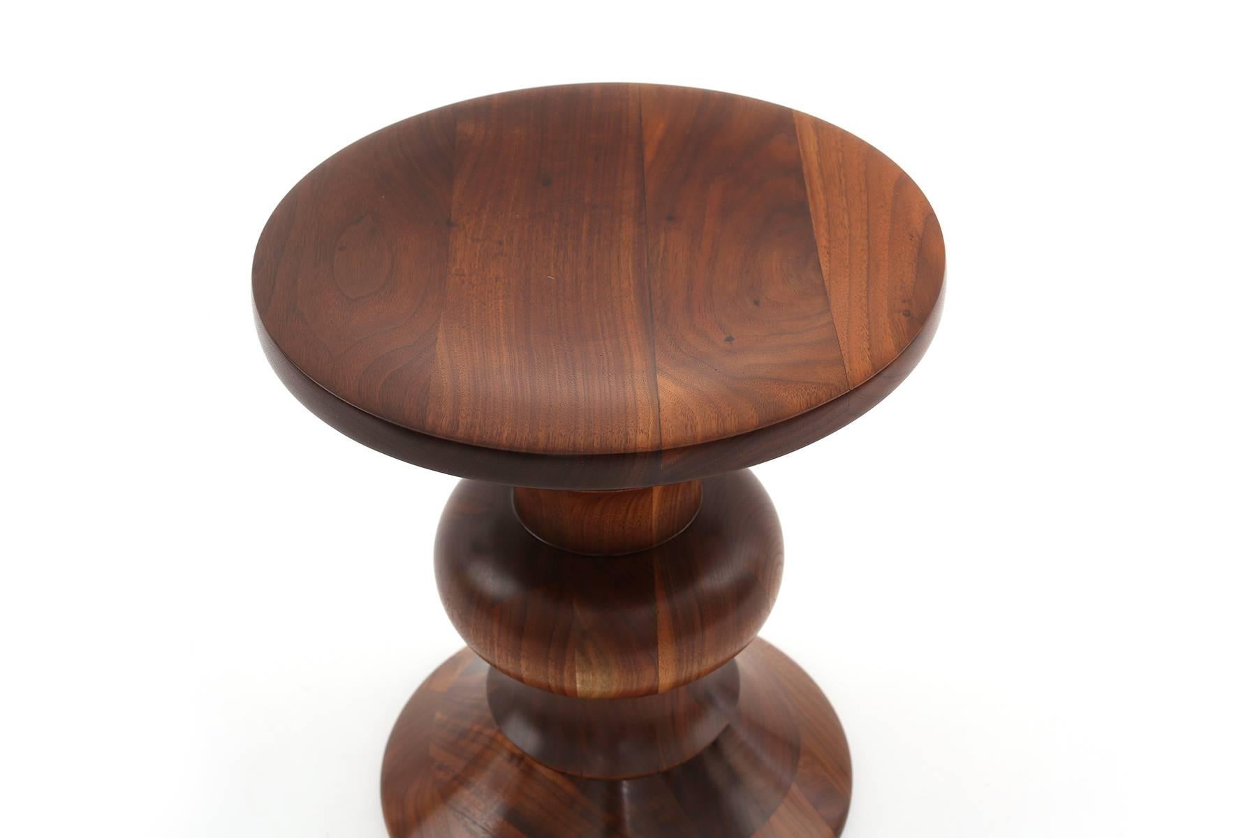 Charles and Ray Eames for Herman Miller time life stool, circa mid-1960s. This solid walnut example has incredible graining and is in excellent condition.