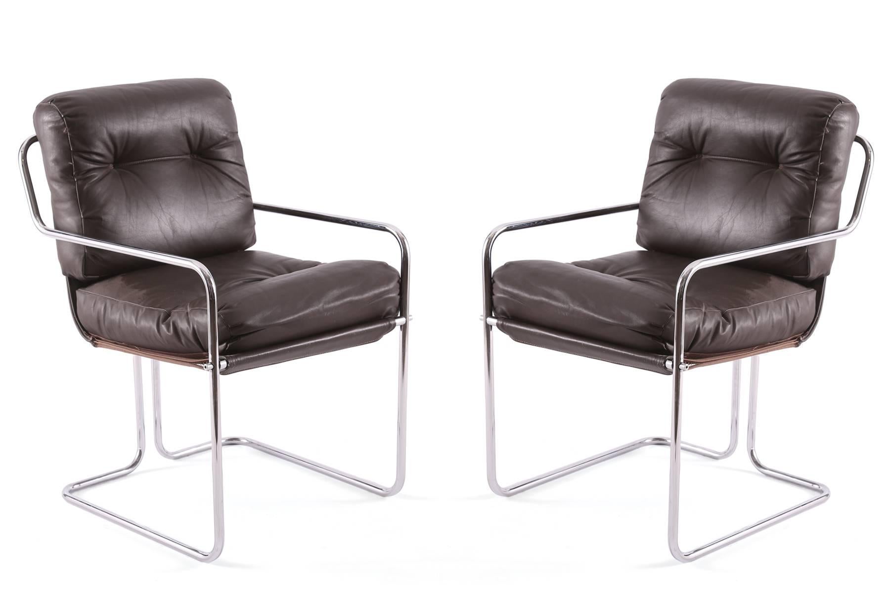 Set of four Guido Faleschini for Pace leather and chrome dining chairs, circa early 1970s. These all original examples retain their original dark chocolate leather with buckle detailing and sculptural chrome frames. Price listed is for the set of