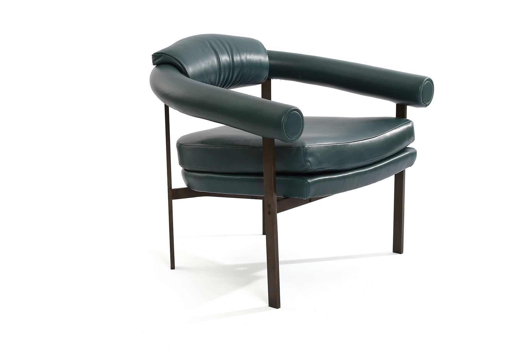 Bronze and leather lounge chairs by Metropolitan Furniture company, circa early 1970s. These stunning examples have been newly upholstered in a supple Aegean blue green leather. Frames are a beautiful patinated bronze. Red has three of these