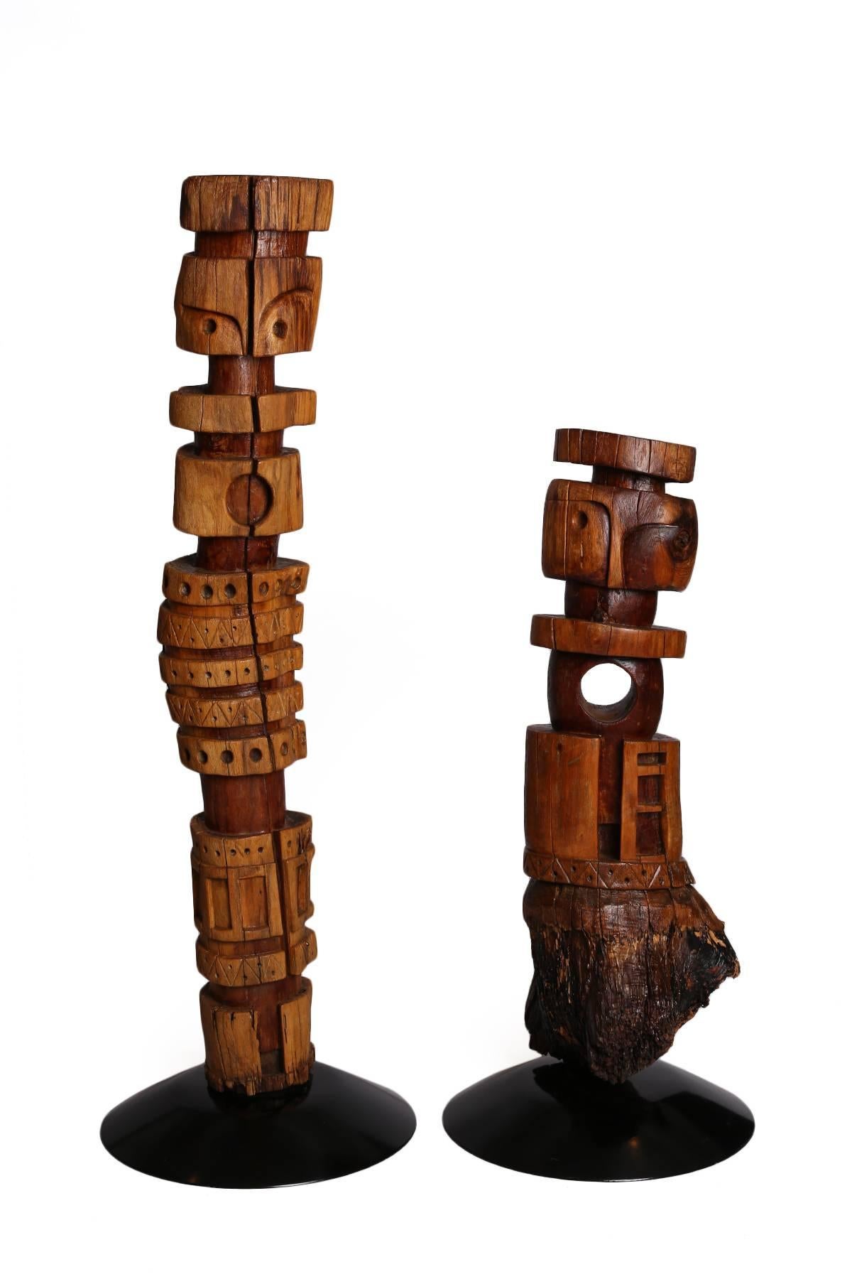 Five monumental Kathy Haun TOTEM sculptures. Haun is a Tucson sculptor now 90 years old. She has been commissioned by individuals and corporations to create hand-carved
doors, sculptures and mobiles. These examples took some 5 years to create. They