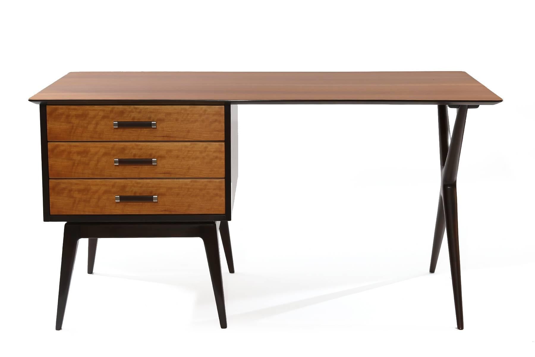Renzo Rutili for Johnson Furniture Company partners desk, circa early 1960s. This two-tone example has beautiful curly maple top and drawer fronts juxtaposed with dark walnut lacquered drawer pulls and legs. It has drawers on both sides so can be a