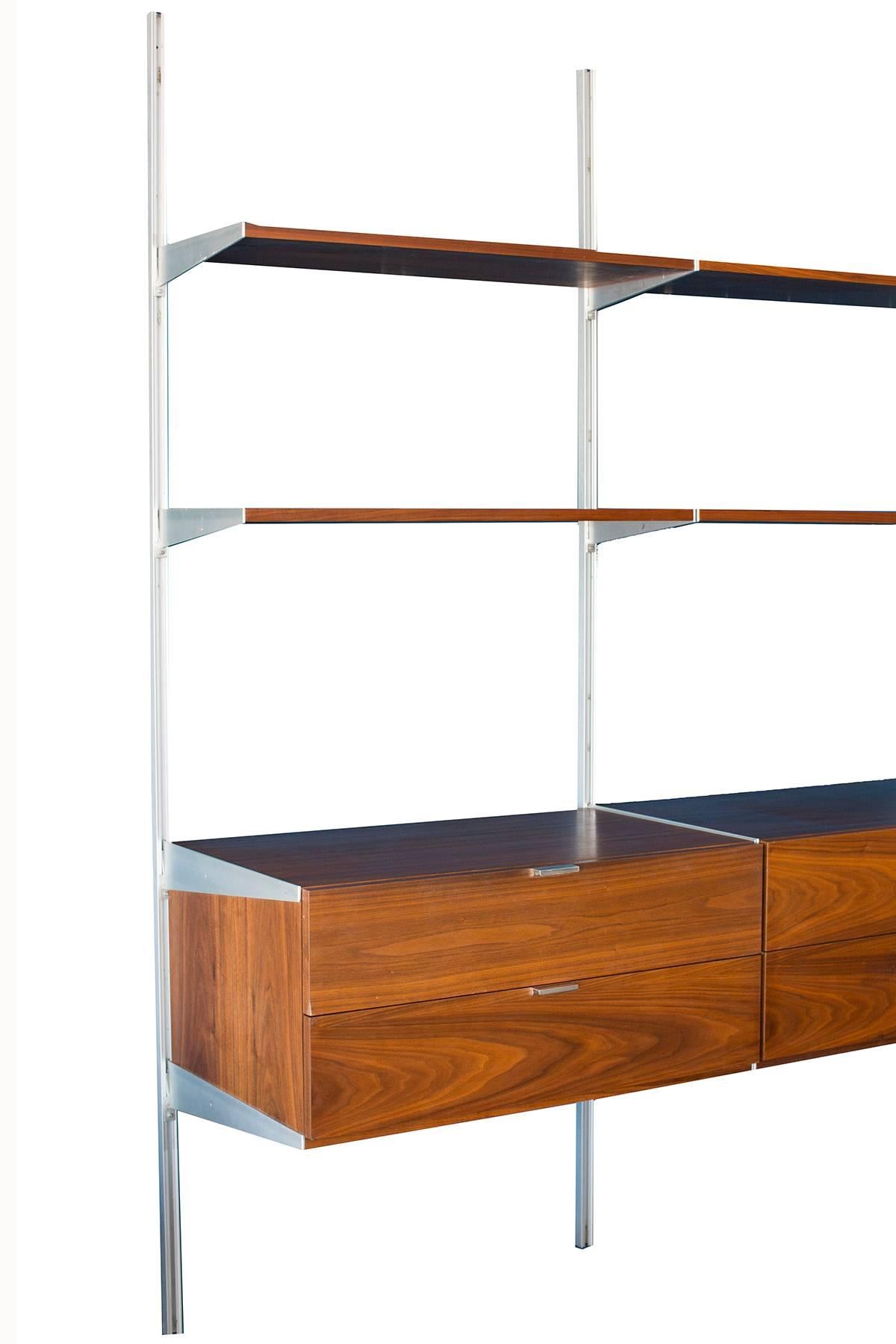 George Nelson for Herman Miller CSS wall-mounted unit, circa early 1960s. This example has six shelves and three chests with two drawers each. Drawer fronts are beautifully grained walnut as are the shelves.
  