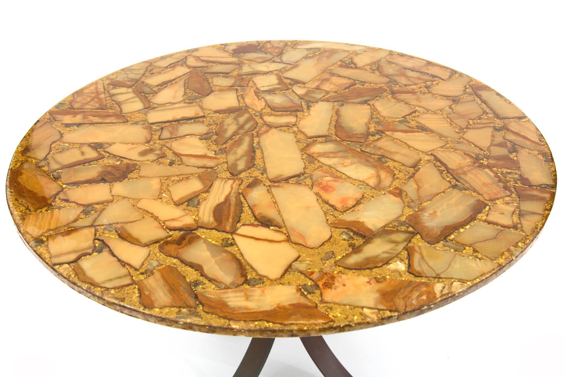 Cut agate and bronze dining table, circa late 1960s. The top of this table has beautifully grained agate pieces and gold flecks beneath resin. The subtly curved steel base is bronze-plated with great patina.