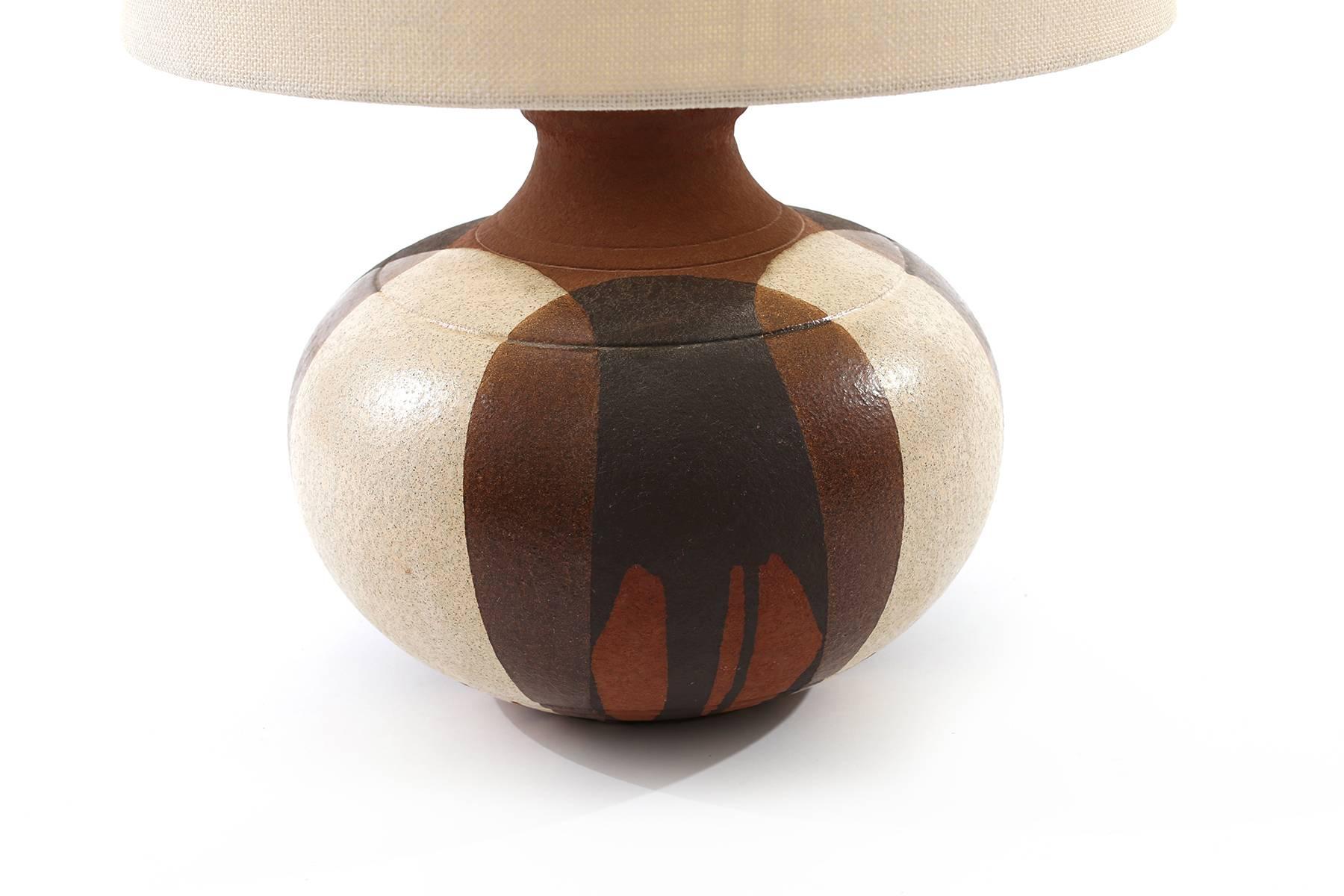Large-scale ceramic lamp by David Cressey, circa early 1960s. This example has glaze hues of white's blacks and earth tones and has been newly wired. Price listed is for the lamp without the shade. Shades can be procured. Please inquire. Height with