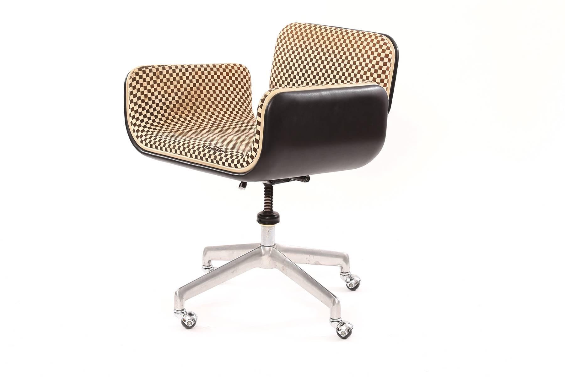 Rare all original Alexander Girard for Herman Miller office chair from 1967. This example has Girard's iconic brown and white checkered upholstery with original black accents on the arms seat bottom and back. Retains original Herman Miller disc tag.
