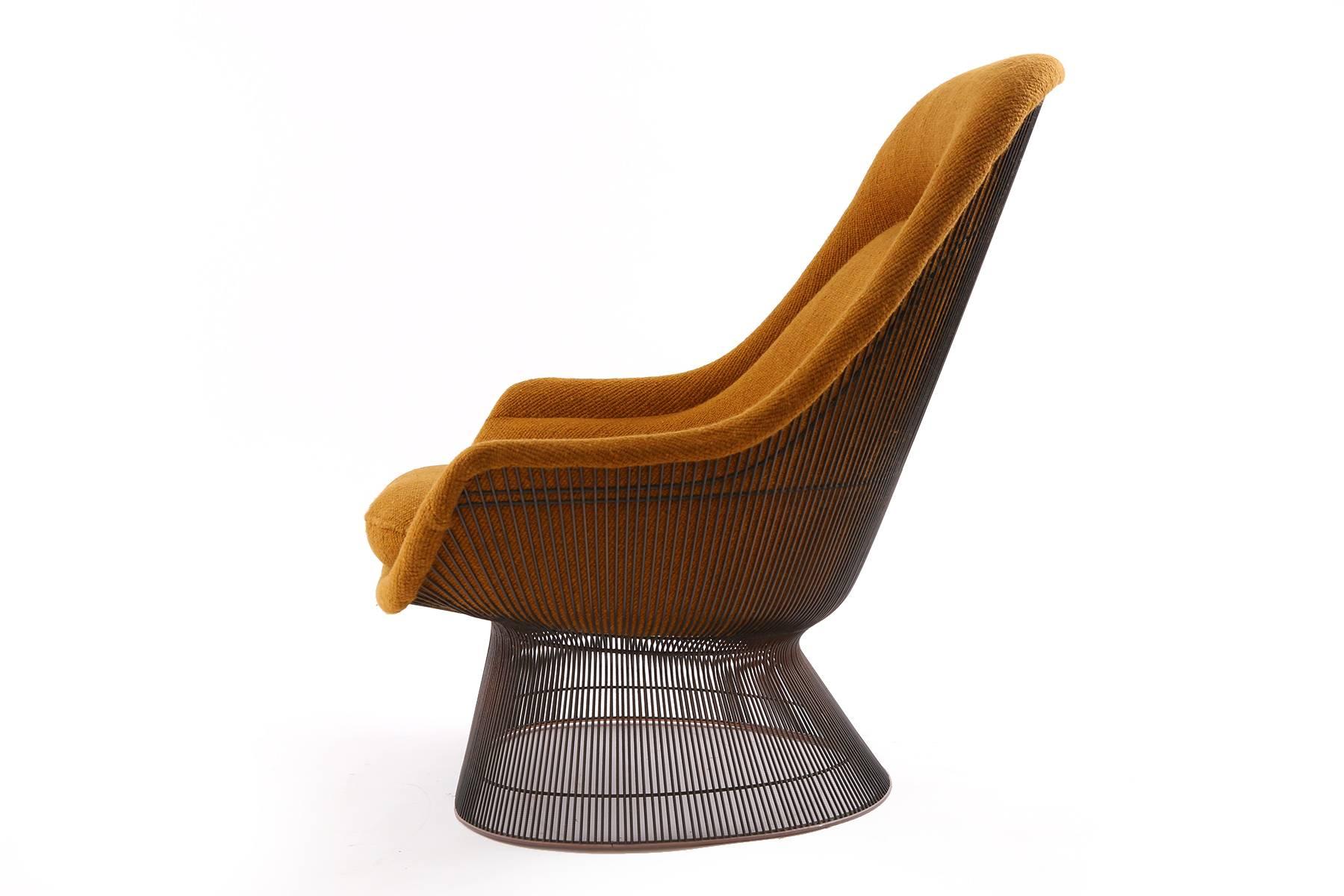 All original Warren Platner for Knoll bronze throne chair and ottoman. This stunning example is upholstered in its original textile and has the desirable bronze frame on the chair and ottoman. Ottoman measures: 15