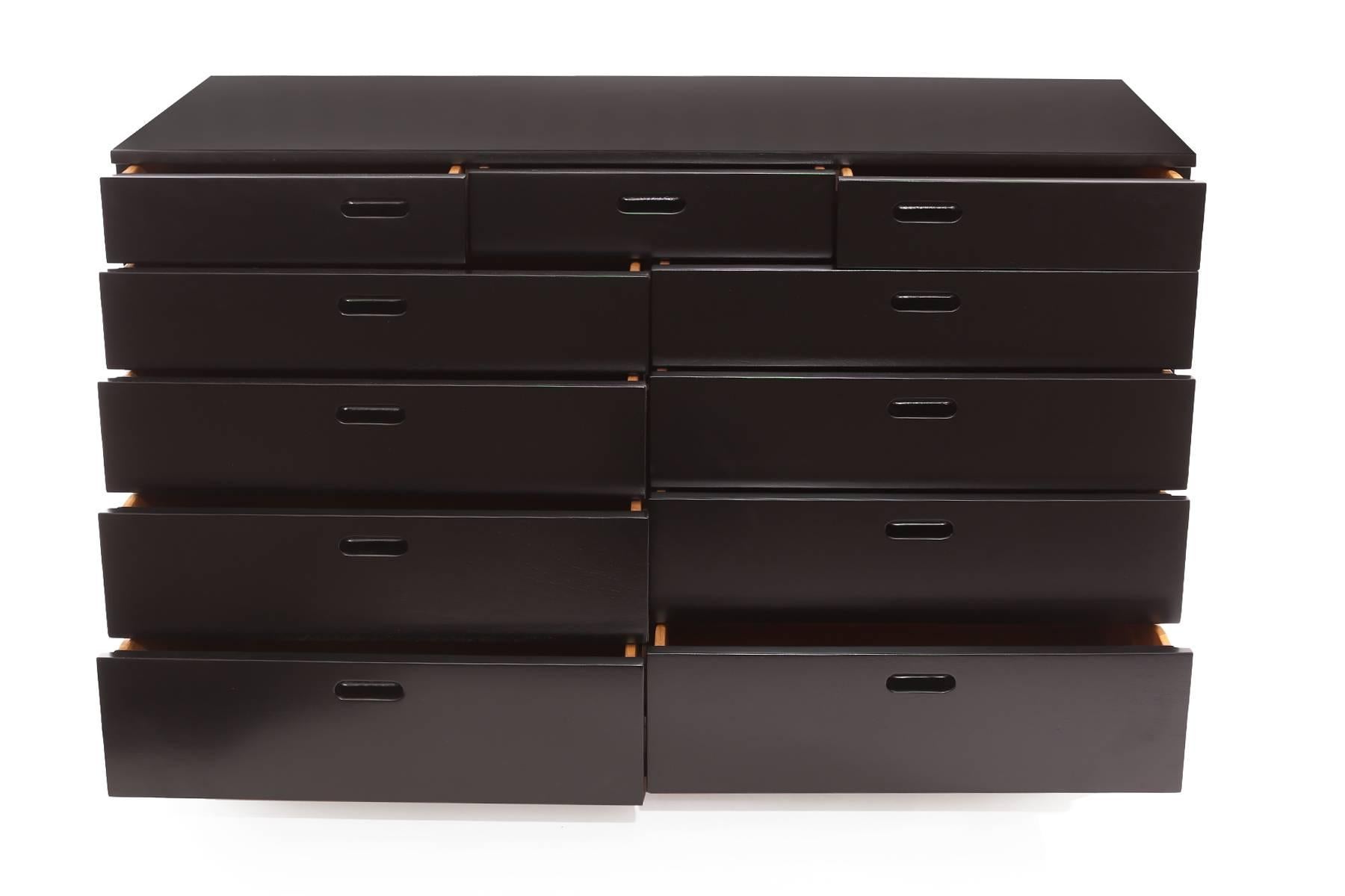 Edward Wormley for Dunbar 11-drawer dresser, circa early 1950s. This example has the early green metal Dunbar label, inset drawer pulls and has recently and impeccably been lacquered black.