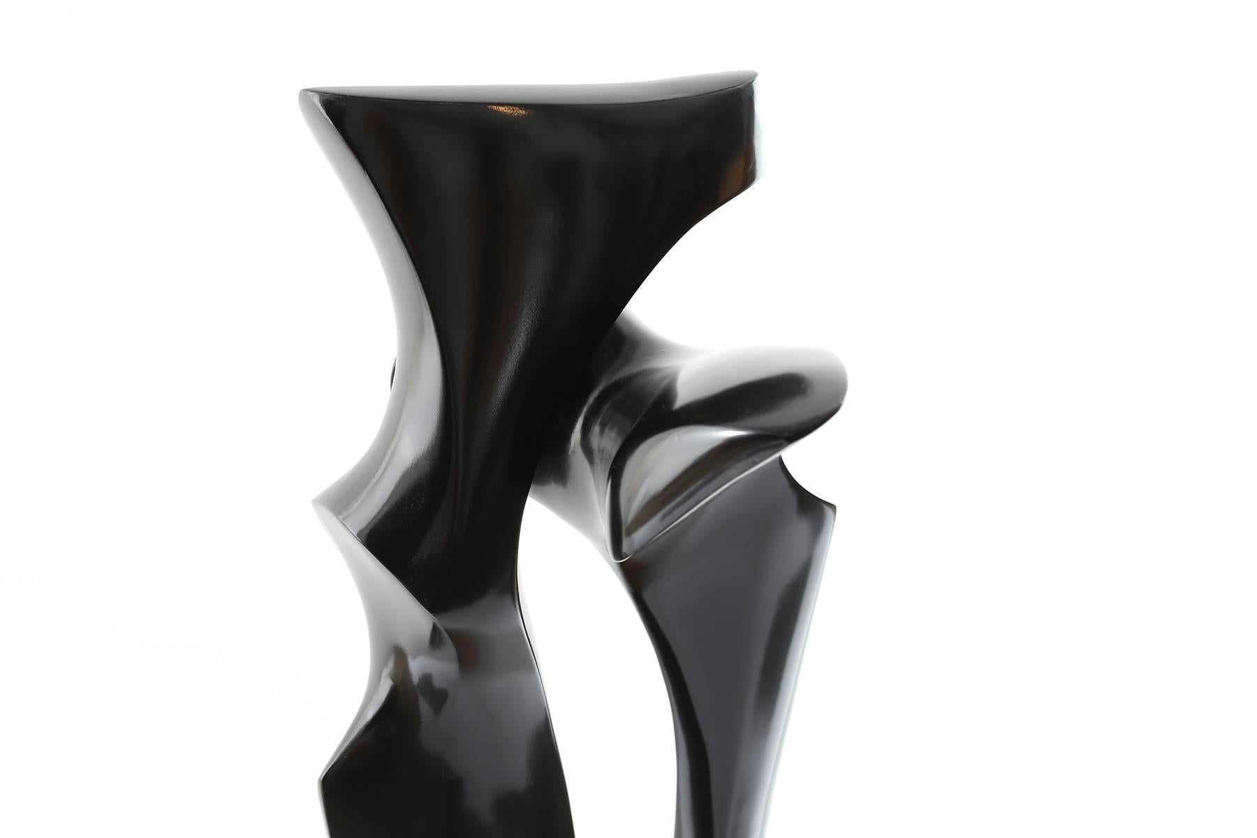 Ebonized wood sculpture, circa early 1970s. This stunning work was unsigned when we acquired it. It stands atop a copper and figural wood base and truly looks stunning from every angle. This was shown some time ago at the Udinotti Gallery in
