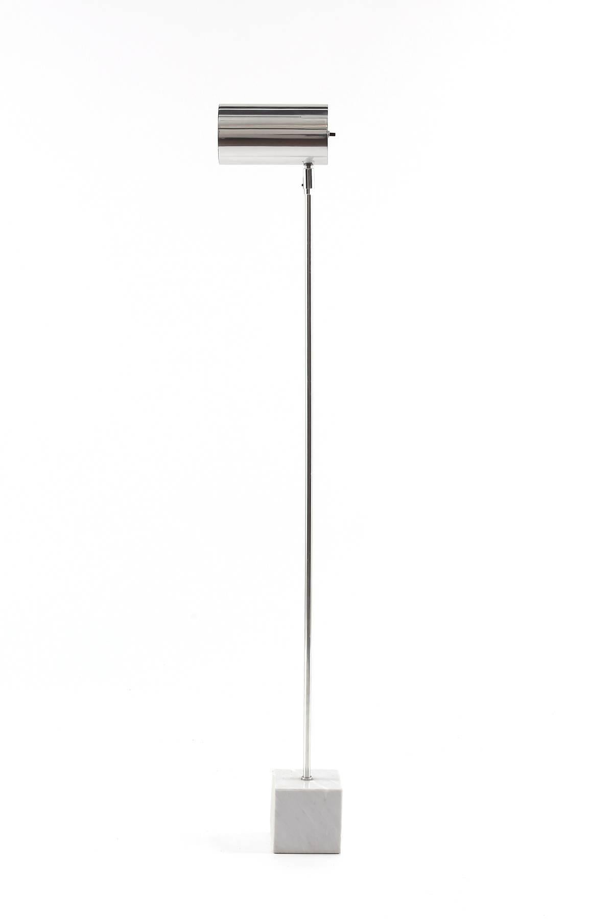 Kovacs calacatta marble and chrome floor lamp circa early 1970s. This example has a pivoting tubular chrome head and solid marble base.