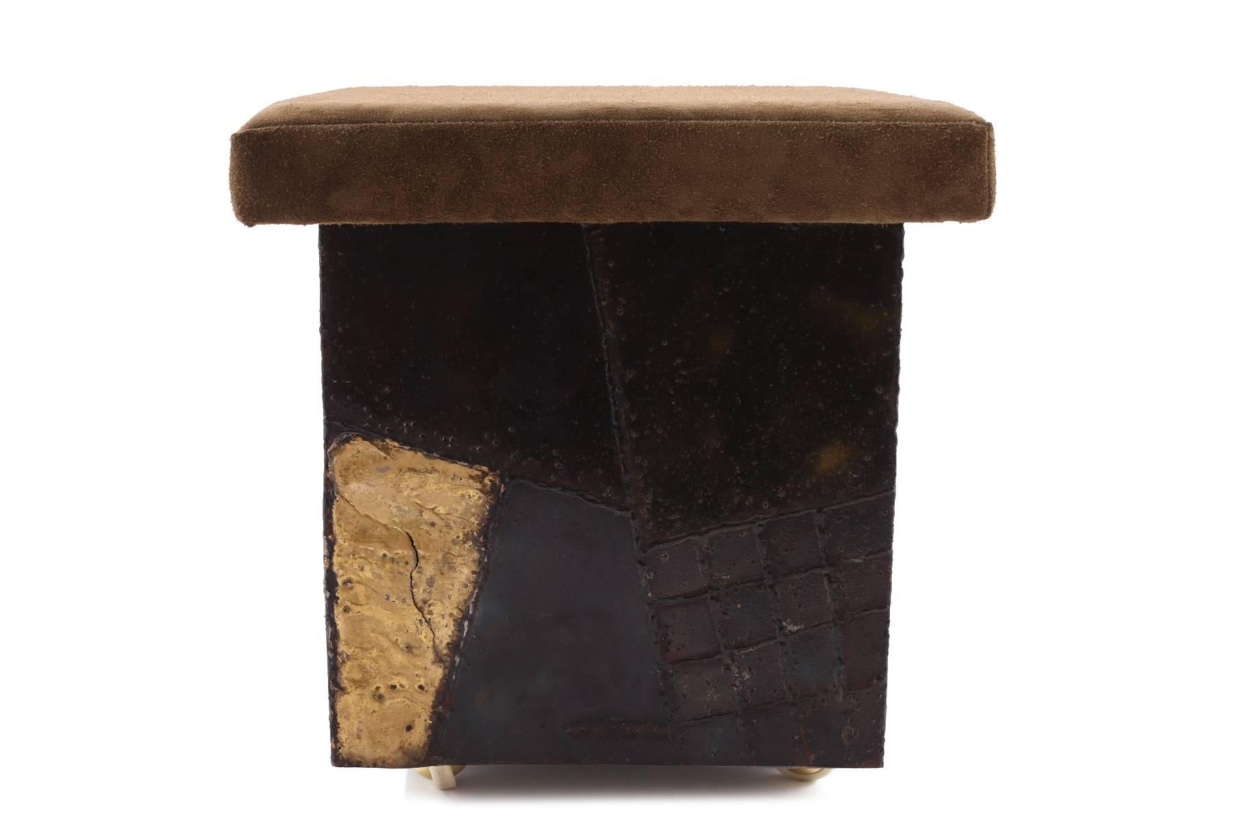 Paul Evans for Directional stool, circa 1969. This signed example has a beautifully patinated and multicolored base and has been recently upholstered in a khaki suede.