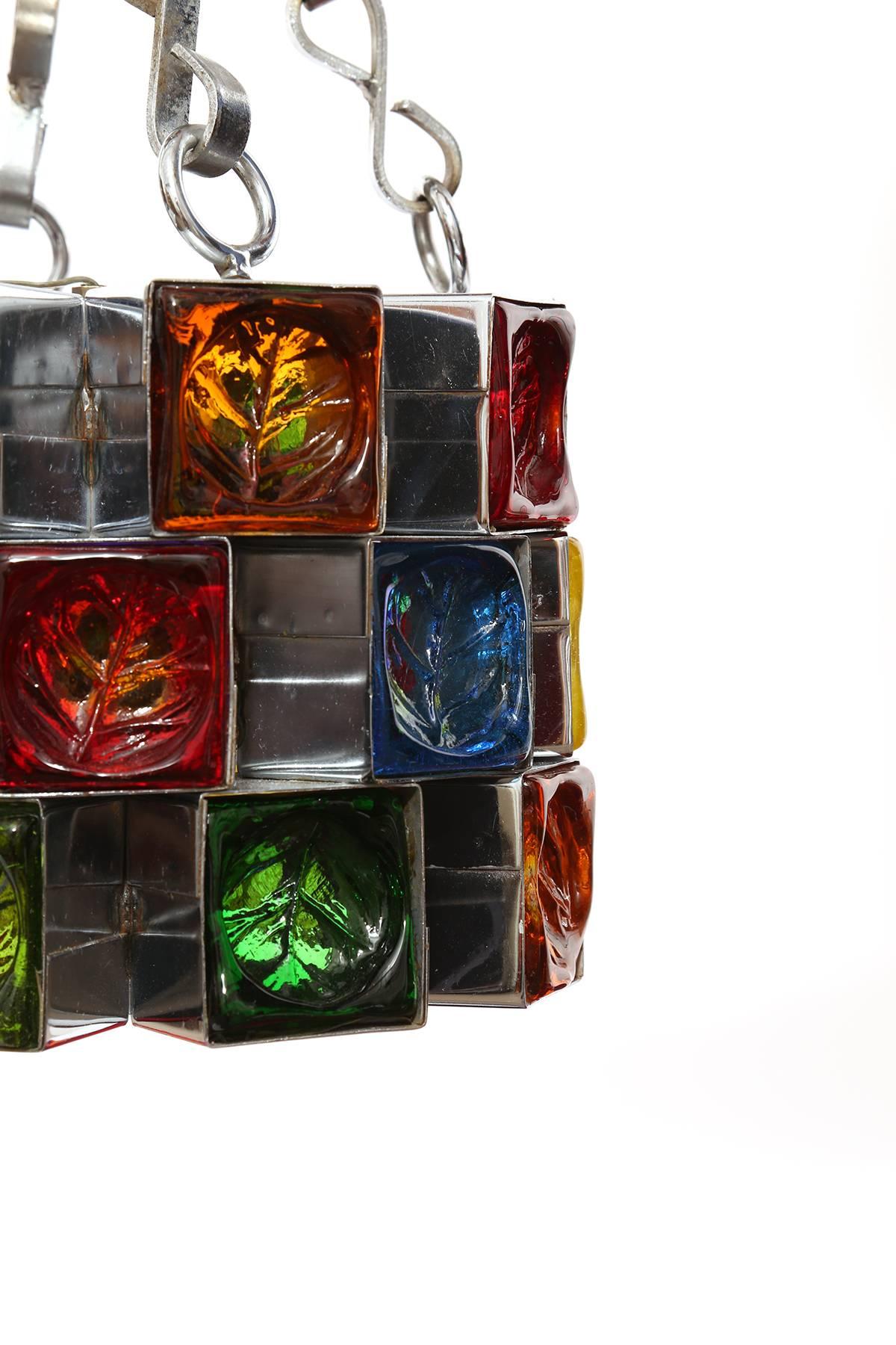 Feder's of Mexico glass and steel chandelier, circa mid-1960s. This example has wonderfully colored leaf motif glass inset in a polished steel frame.