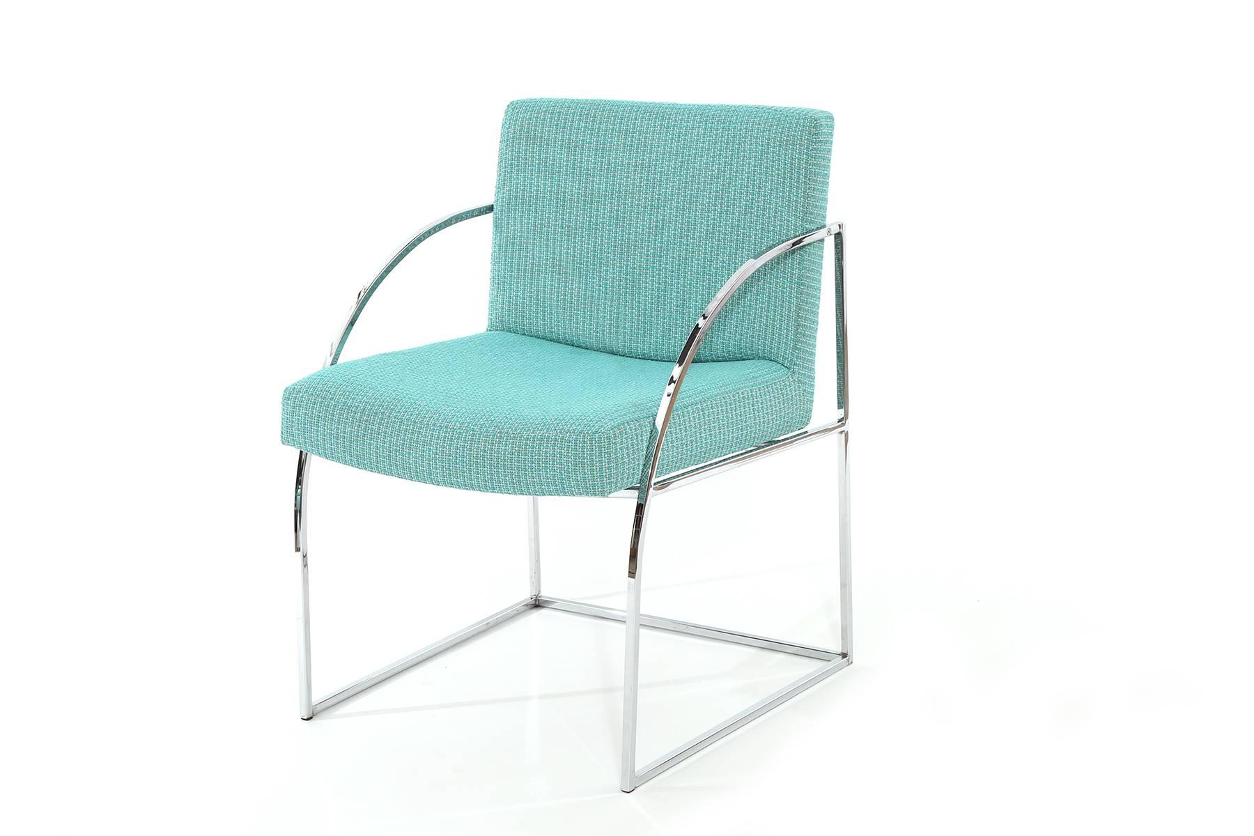 Four Milo Baughman for Thayer Coggin dining chairs, circa early 1970s. These examples have polished chrome frames and have been newly upholstered in a sky blue textile. Price listed is for the set of four.