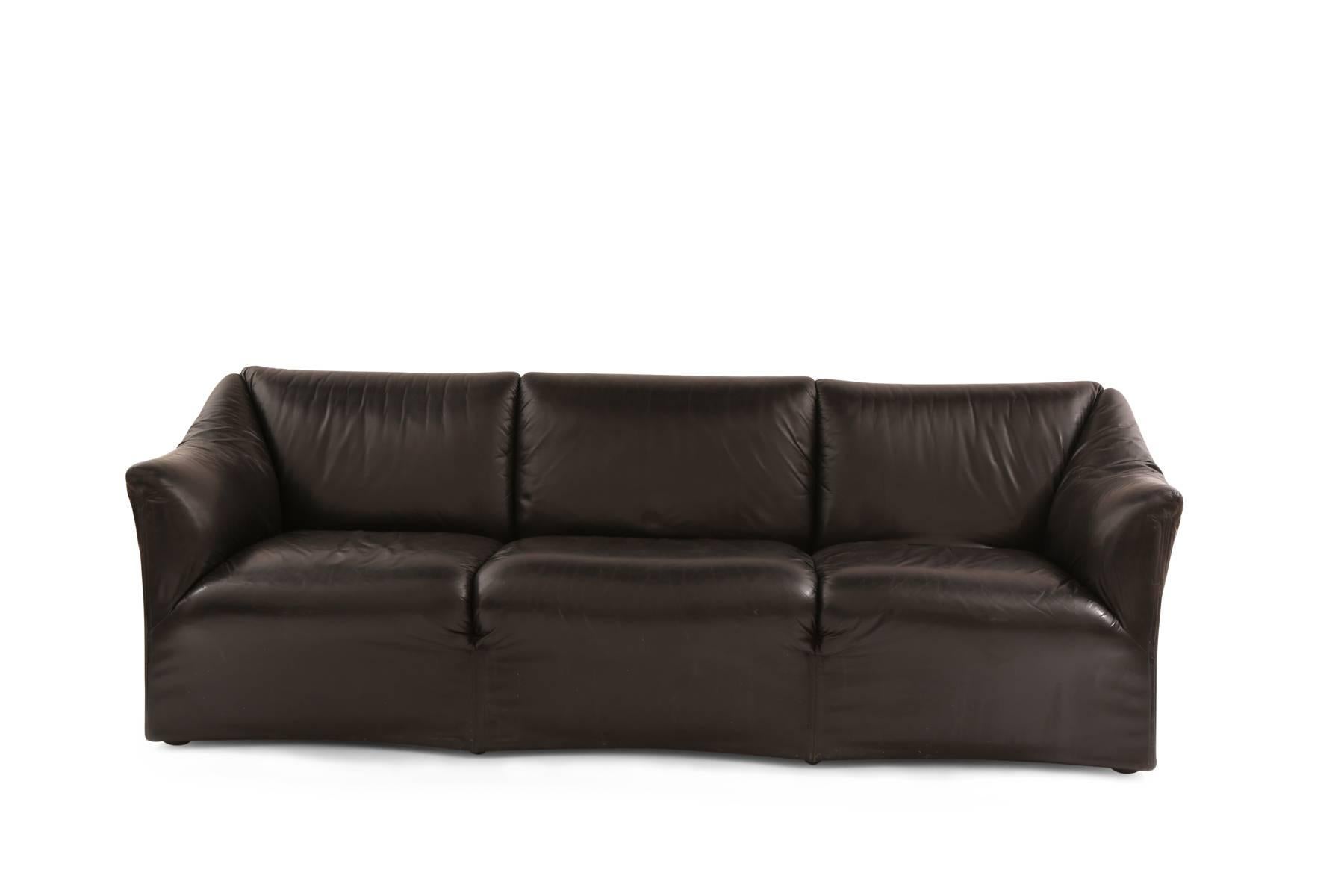 Mario Bellini for Cassina 'Tentazione' sofa circa mid-1970s. This all original example has a sculptural wavy front and back and tapered arms. It is upholstered in its original supple black leather.
