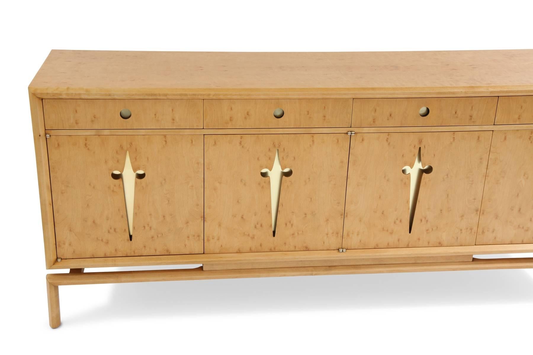 Edmund Spence maple and brass chest, circa late 1950s. This example has beautifully grained solid maple case legs and drawer fronts with interior and exterior drawers. The drawer and door pulls have inset brass. It has been newly and impeccably