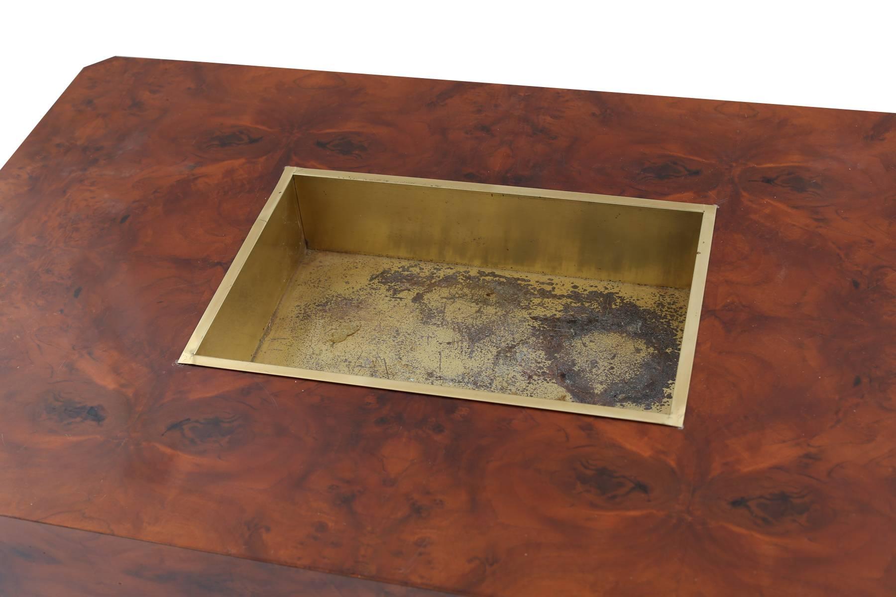 Willy Rizzo burl and patinated brass cocktail table, circa early 1970s. This all original example has a beautifully grained burl top and inset plinth base. It has architecturally formed brass corners and inset brass tray. Has age appropriate wear on