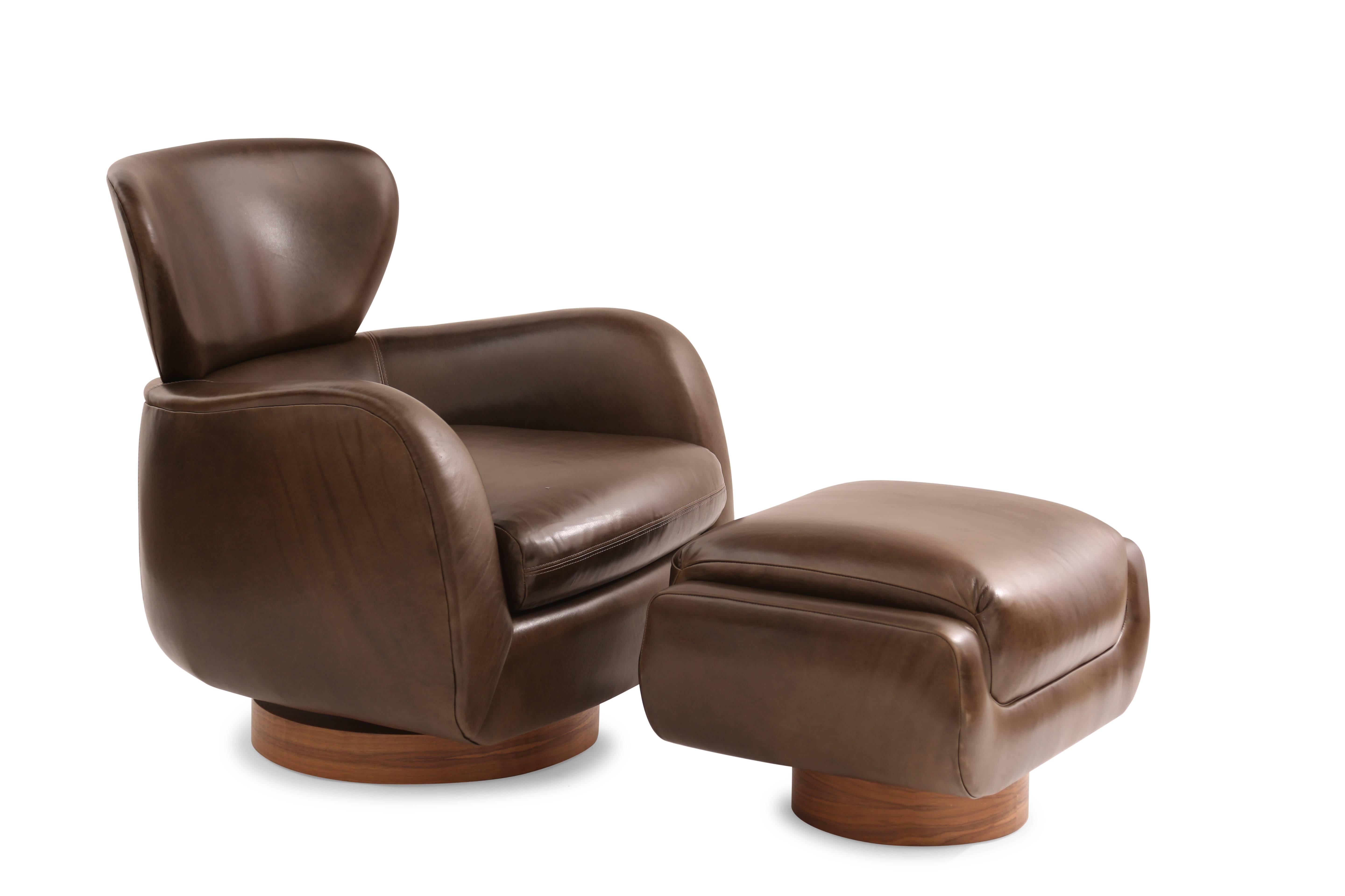 Pair of Vladimir Kagan for Directional swivel and reclining lounge chairs, circa late 1970s. These stunning examples have been newly upholstered in a beautifully patinated olive leather that works beautifully with the walnut bases.
Labeled. Price