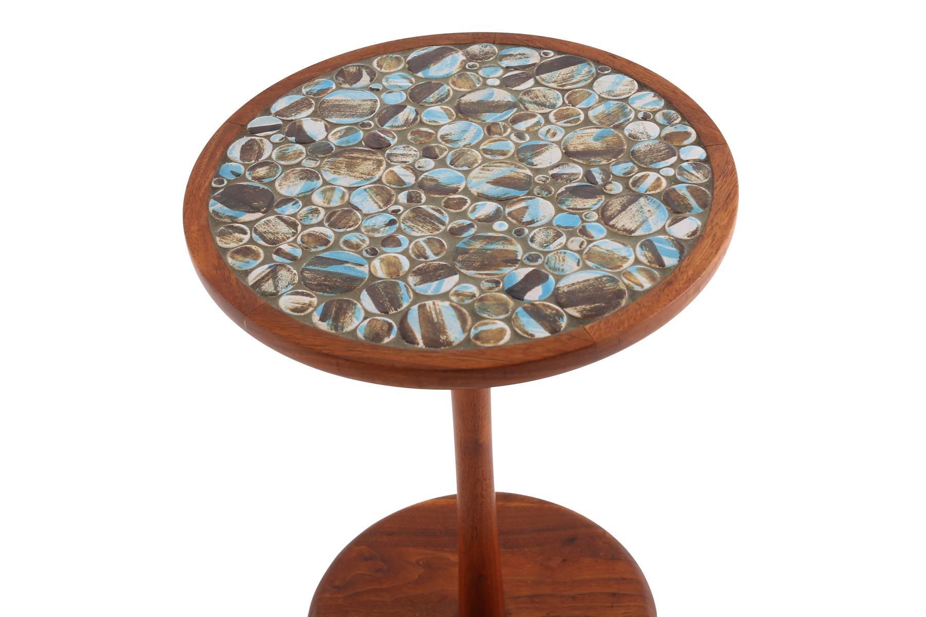 Jane and Gordon Martz for Marshall Studios walnut and tile side table, circa early 1960s. This all original example has seldom seen tile with hues of blues and earth tones and is in excellent condition.