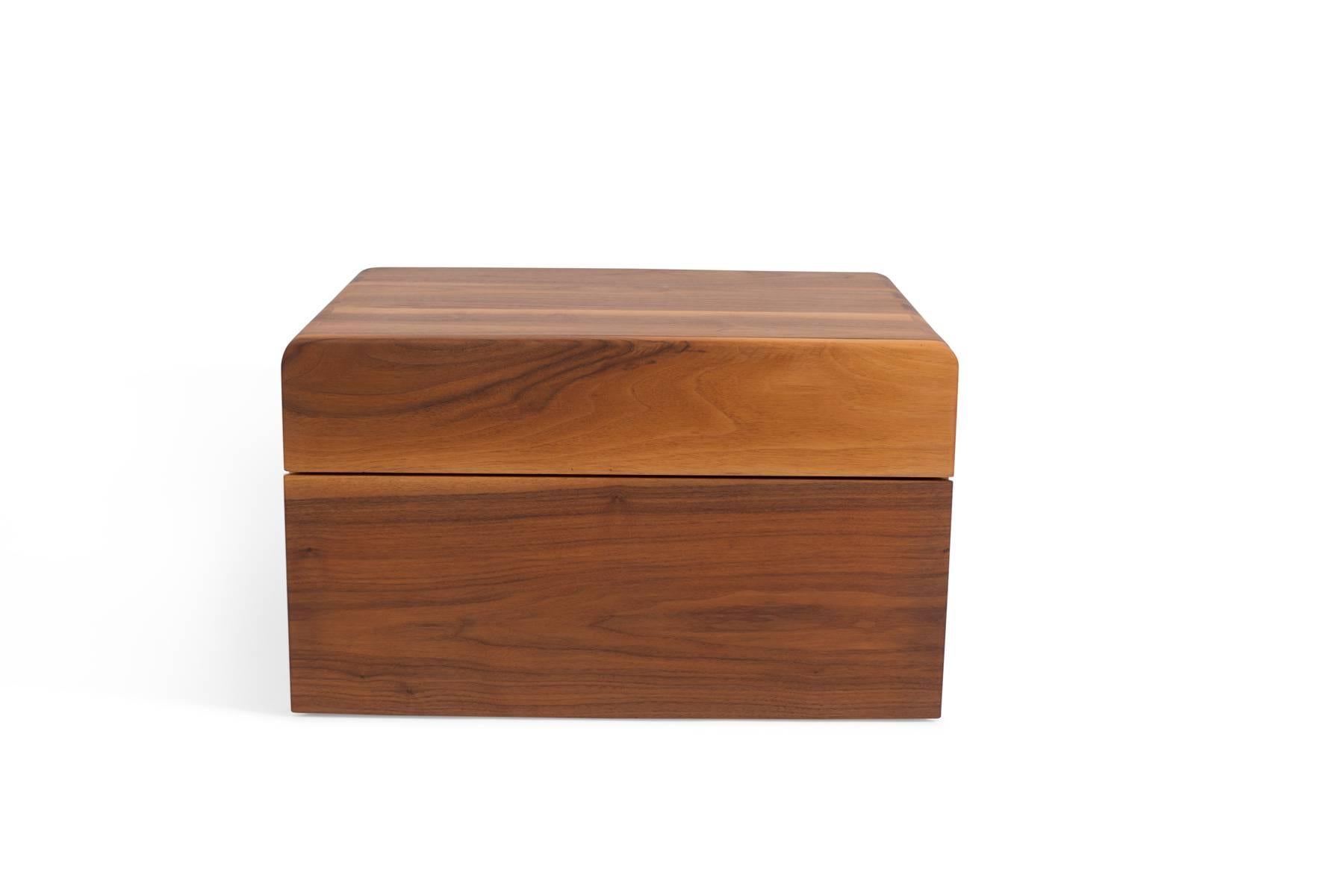 Allen Ditson solid walnut jewelry or tabletop chest commissioned in 1957. This example is executed in beautifully grained solid walnut. It has exposed large dove tail joints on both sides of the top and two large drawers for more than ample storage.