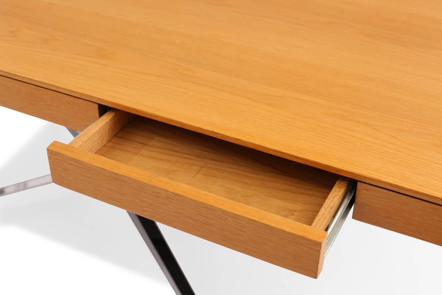 Florence Knoll for Knoll partners desk, circa mid-1970s. This example has a beautifully grained and newly finished oak top, with two drawers on each side and chrome-plated steel X-base.