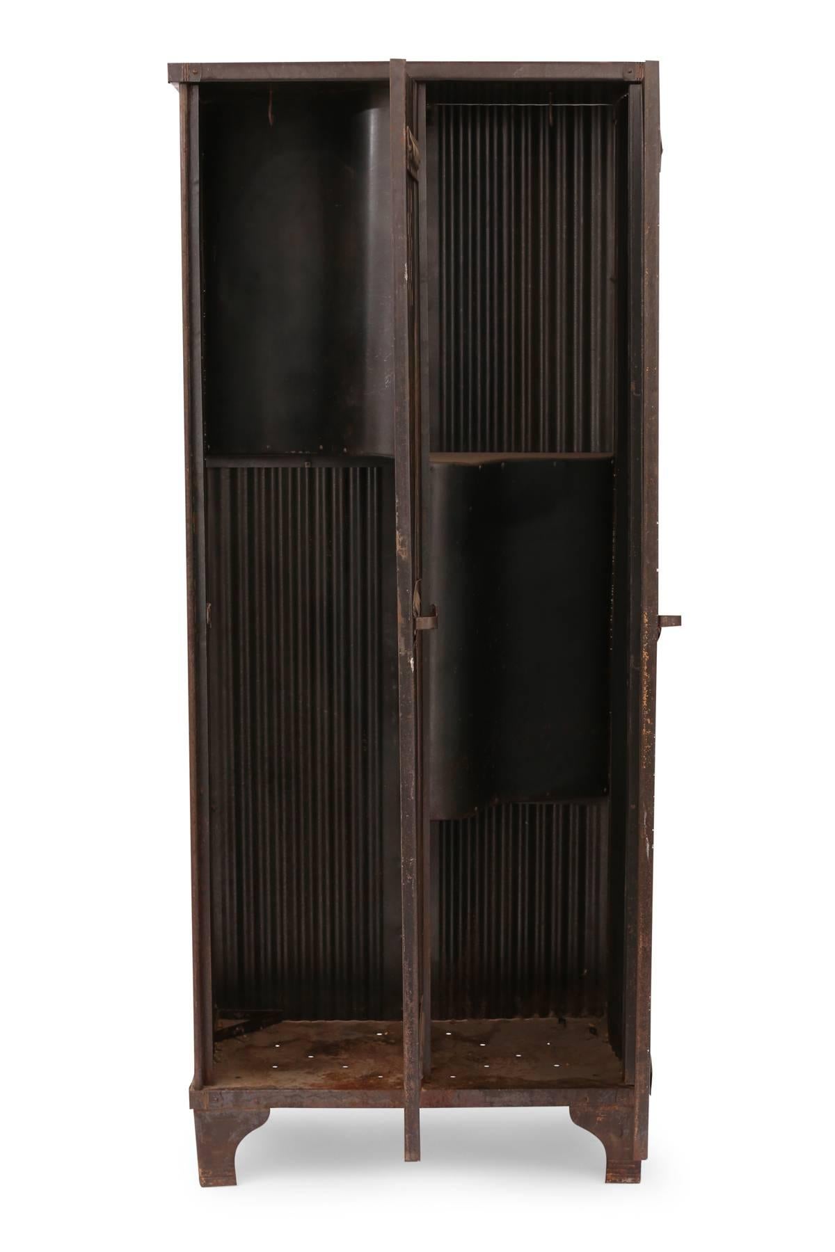 1940s industrial metal locker or armoire from France. This all original example has a rich patina and seamlessly blends with streamline mid century or deco items. Great for indoors or out.