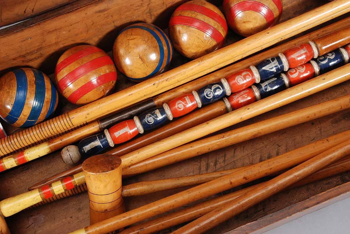 Early 20th Century Eight Mallet Croquet Set with the Original Mahogany Stand For Sale