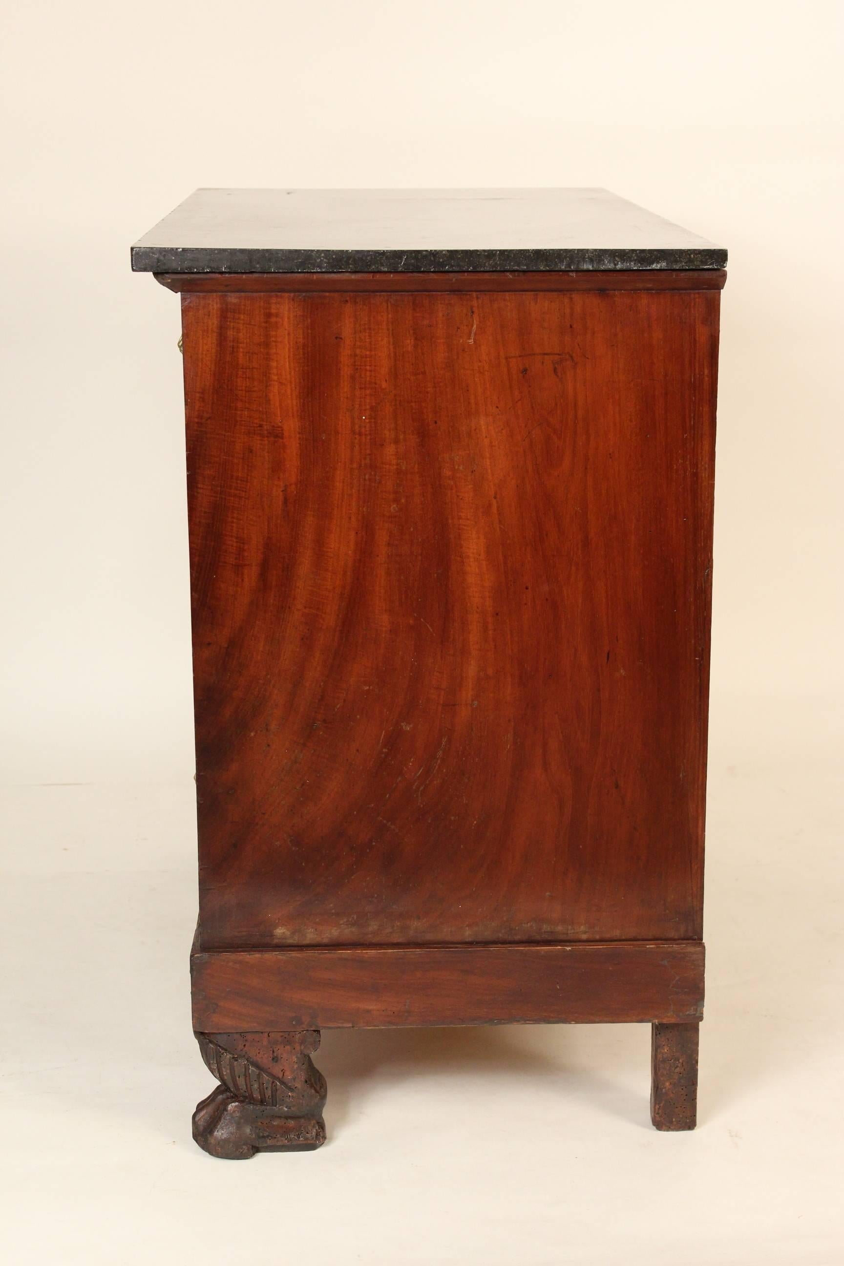 Empire mahogany commode with paw feet and a marble top, circa 1825. This chest has very nice color and the hardware is original.