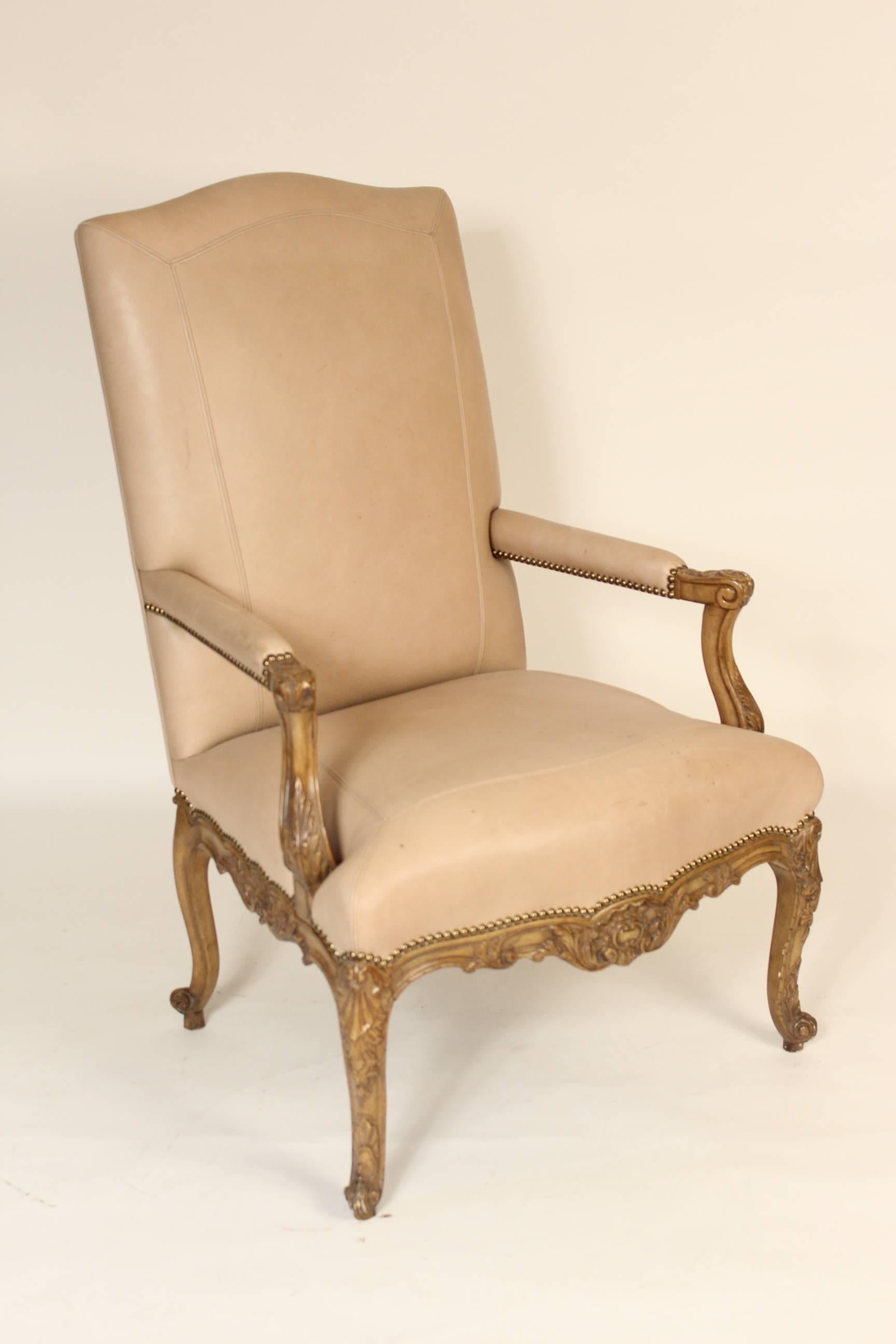 Pair of leather upholstered Louis XV style open armchairs, circa 2000.