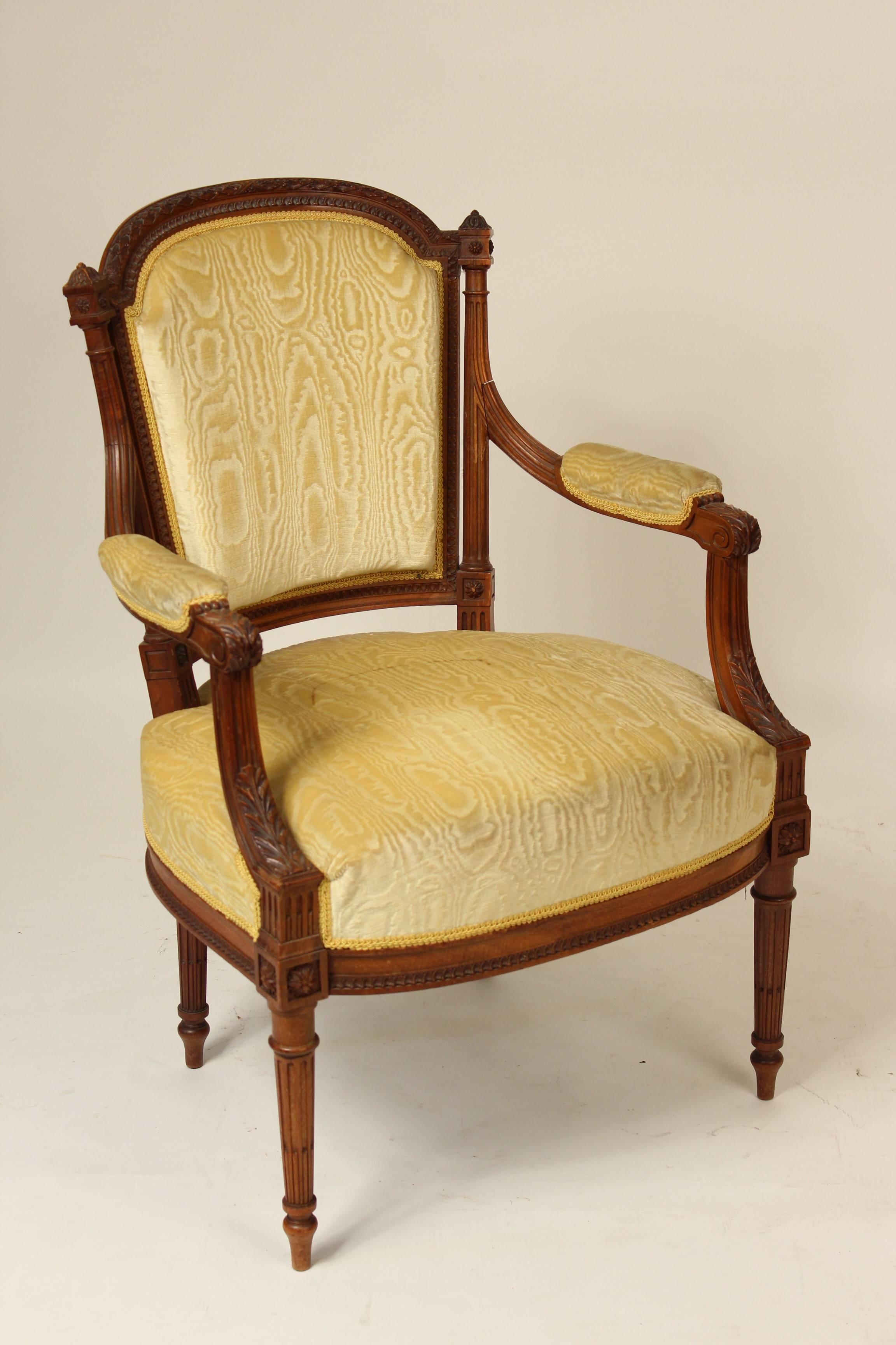 Pair of Louis XVI style carved walnut armchairs, circa 1920.