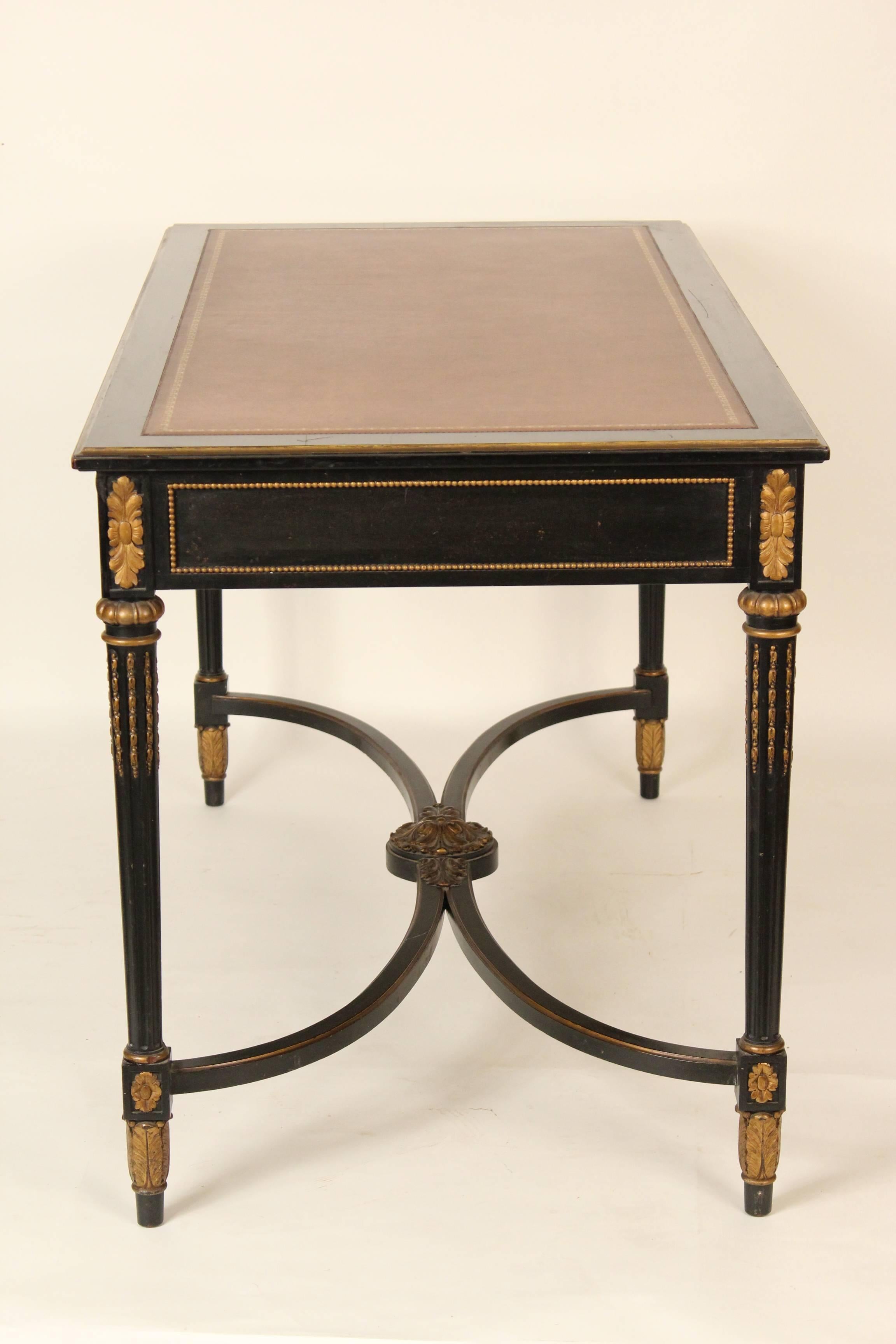 Louis XVI style black painted and gilt decorated desk with a later tooled leather top, circa 1930.