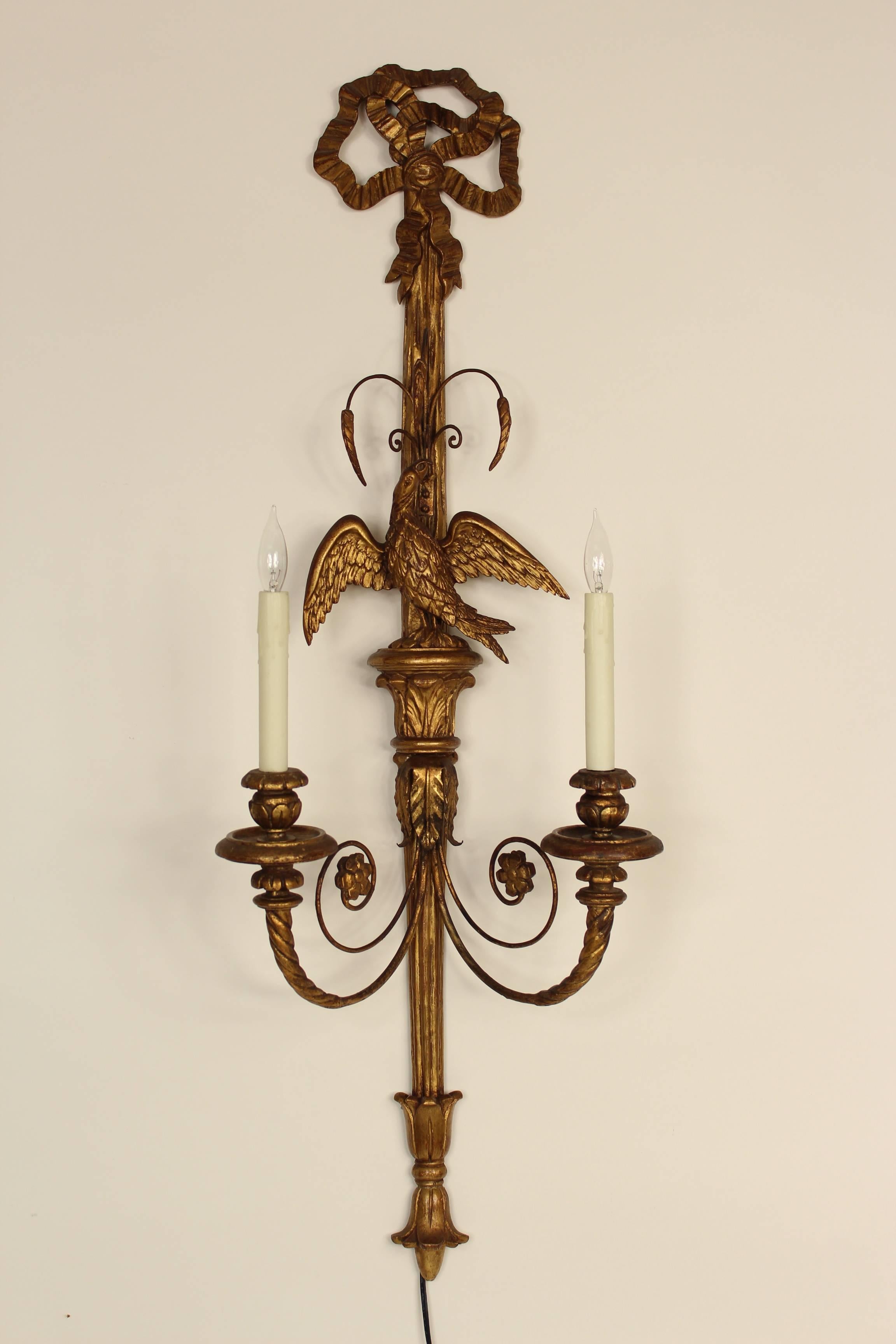 Pair of Italian neoclassical style giltwood wall sconces, mid-20th century. This is a nice large pair of wall sconces with carved eagles.