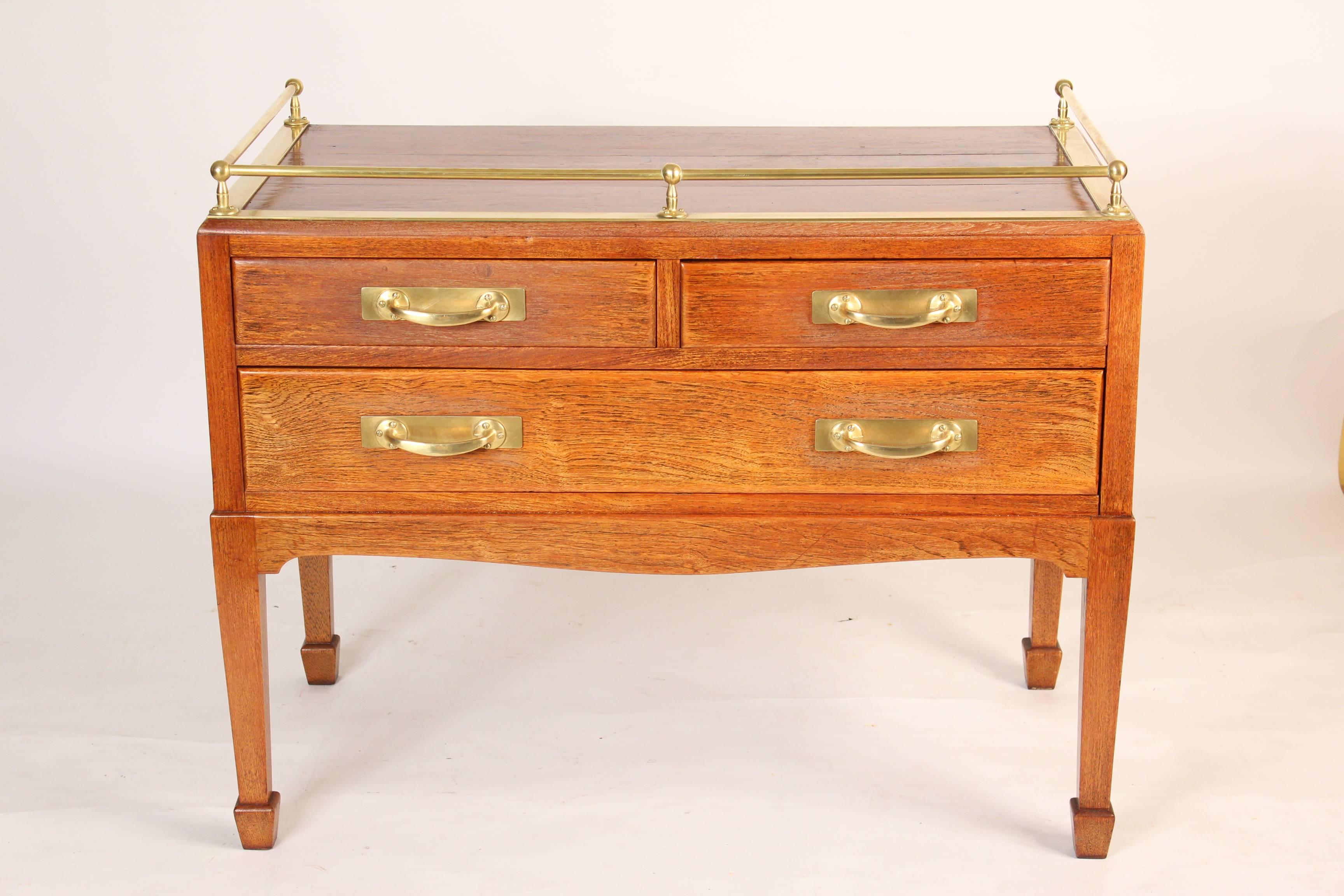 George III style teak and brass ships server, mid-20th century. The back is stencilled 