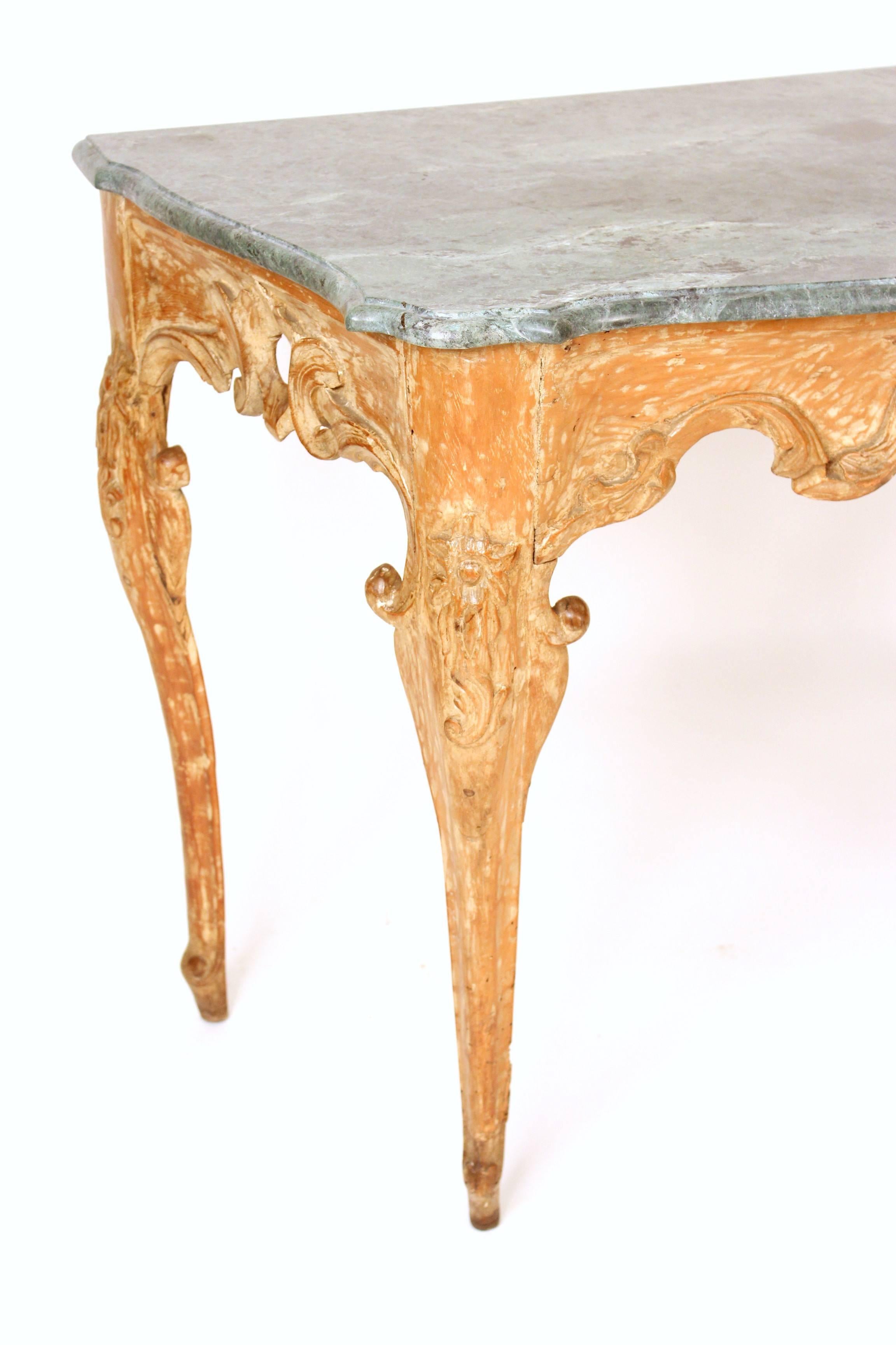 Italian Louis XV marble top console table with traces of old paint, early 19th century. The marble-top is late 20th century.