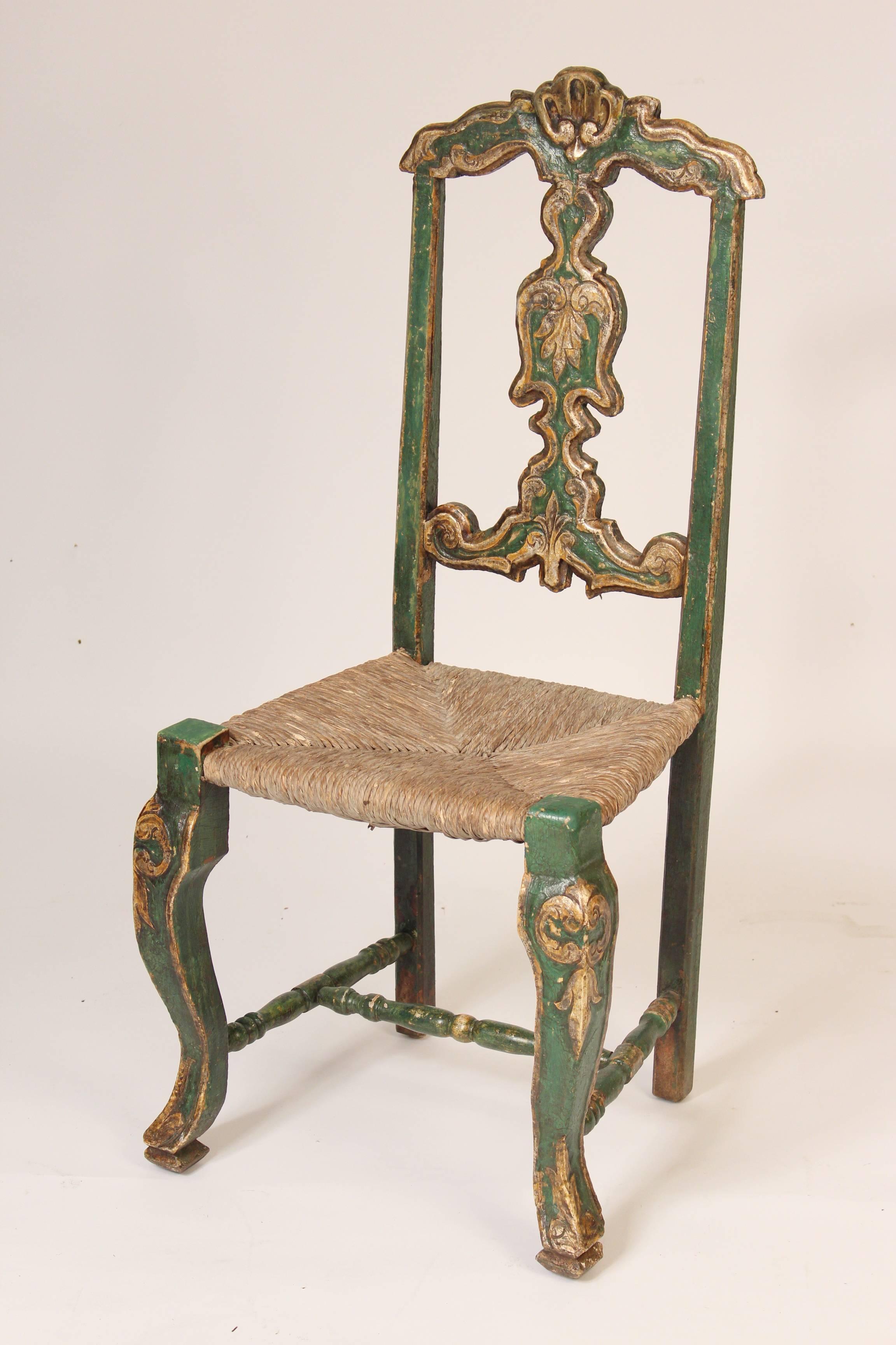 Set of six green painted and silver leaf continental (probably Spanish or Portuguese) dining room chairs with rush seats, 19th century.