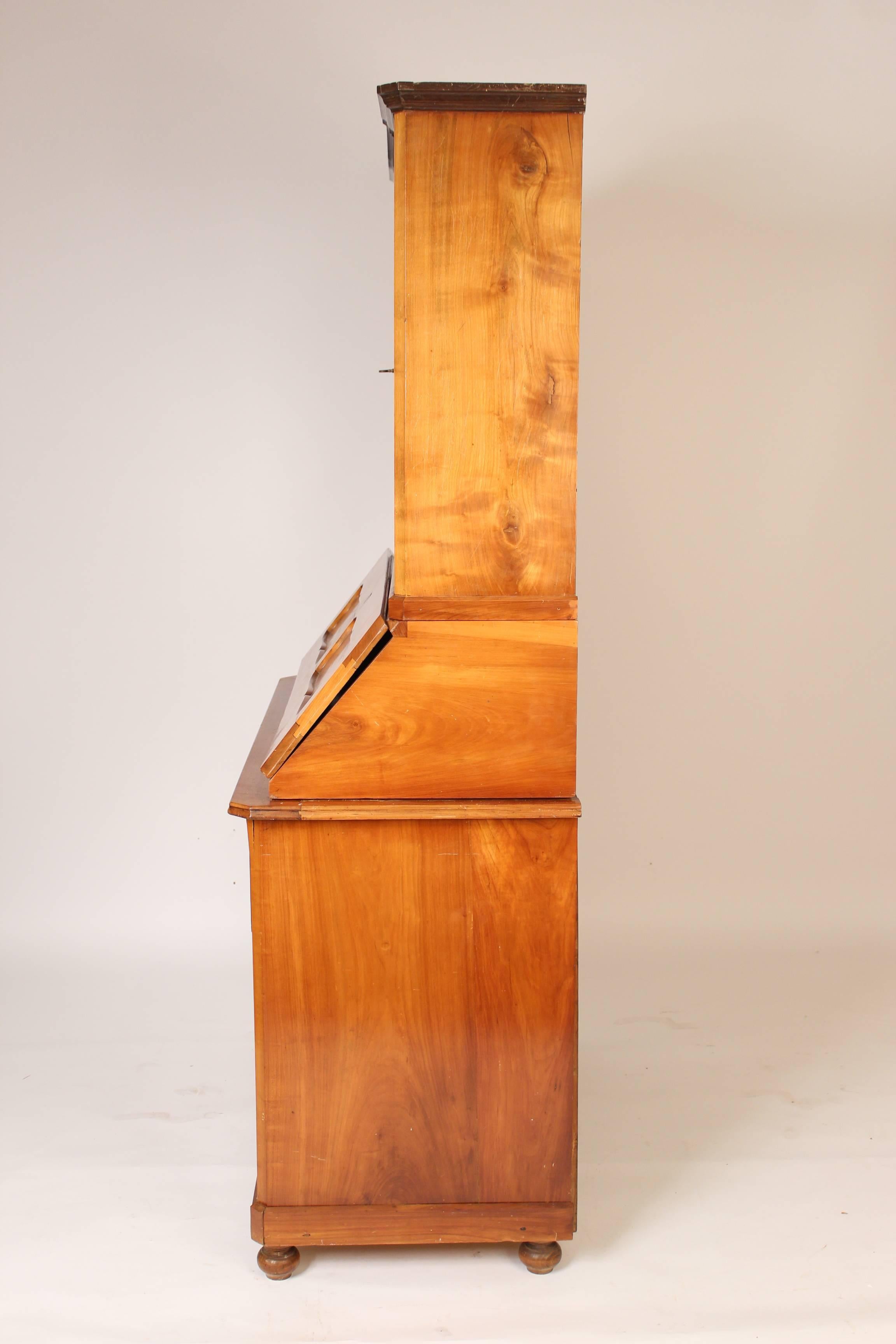 Biedermeier three part cherrywood secretary, circa 1840.