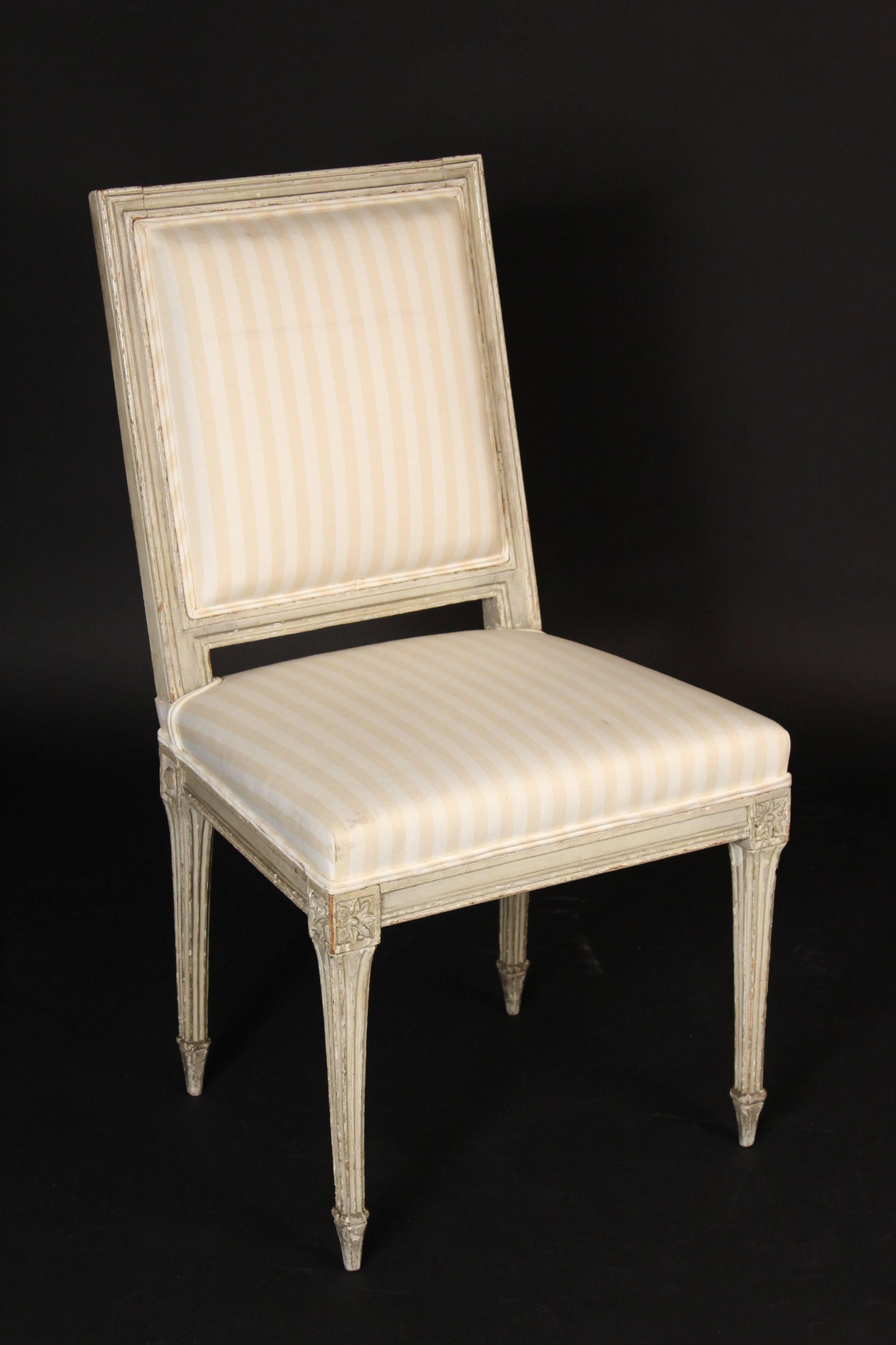 Set of four grisaille painted Louis XVI style painted side chairs, 19th century.