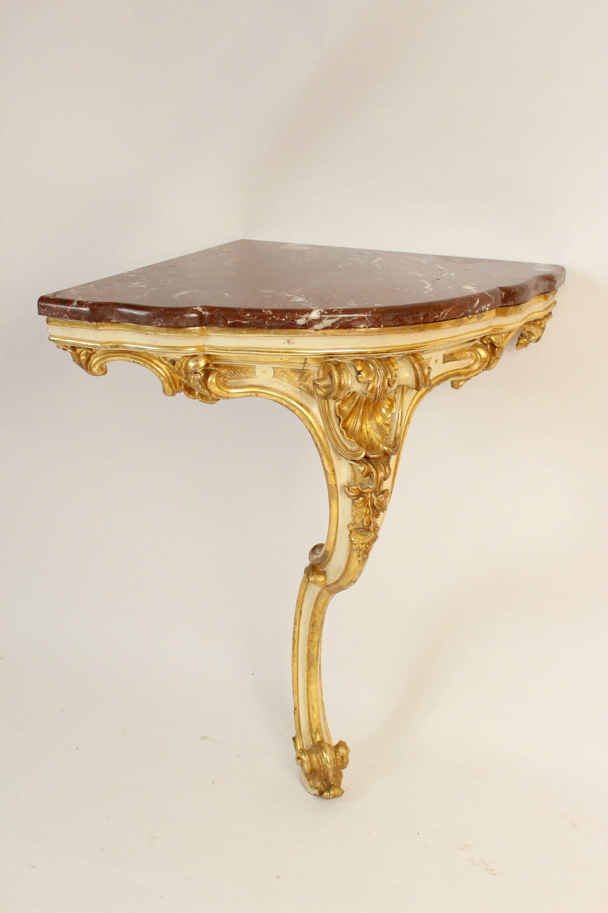 Antique Louis XV style painted and gilt decorated (gold leaf) marble-top console table, early 19th century. This console table has excellent quality carving and gilding. Approximately 10% of the gilding has been restored.