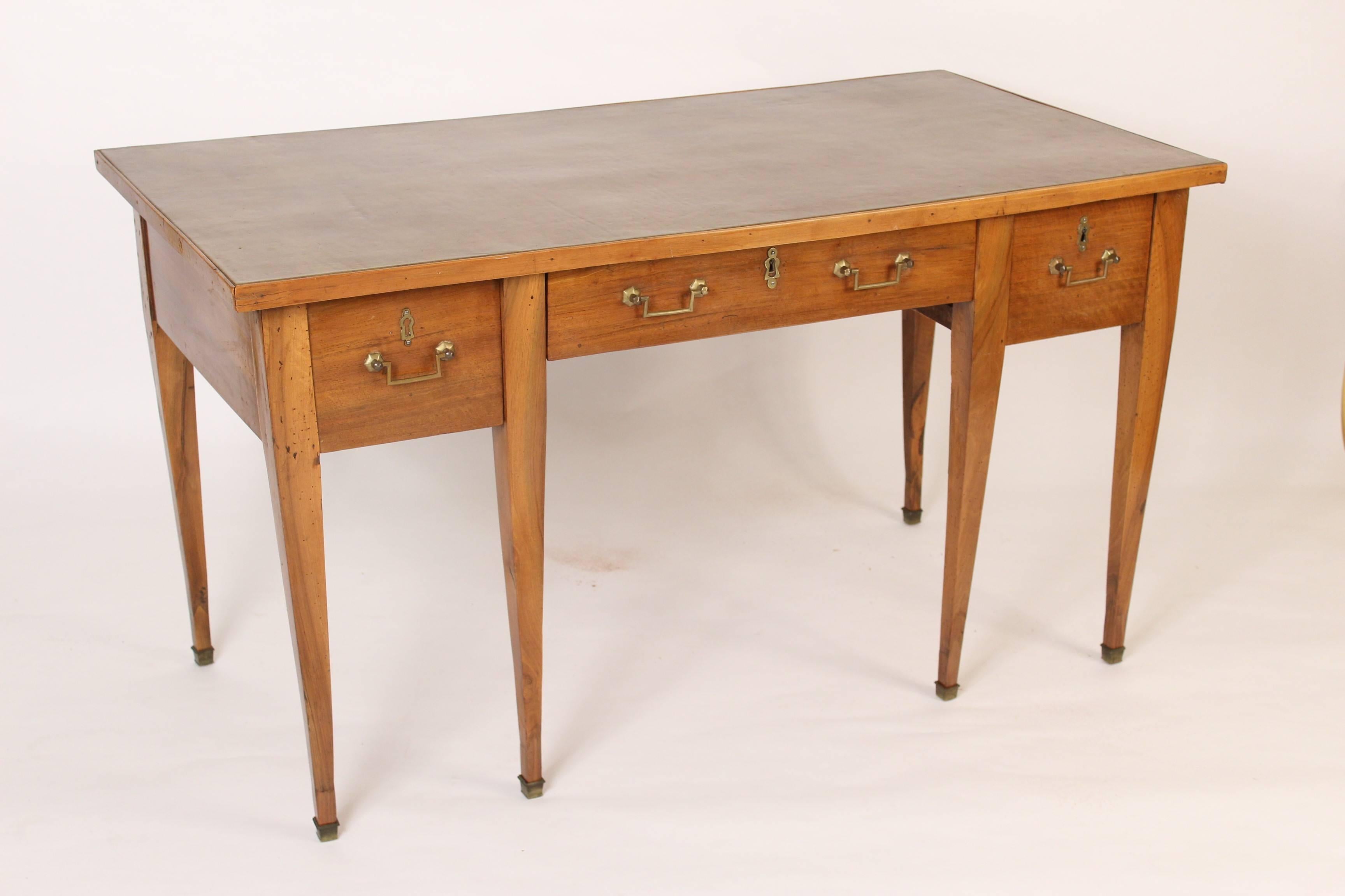 Directoire walnut leather top desk, early 19th century.