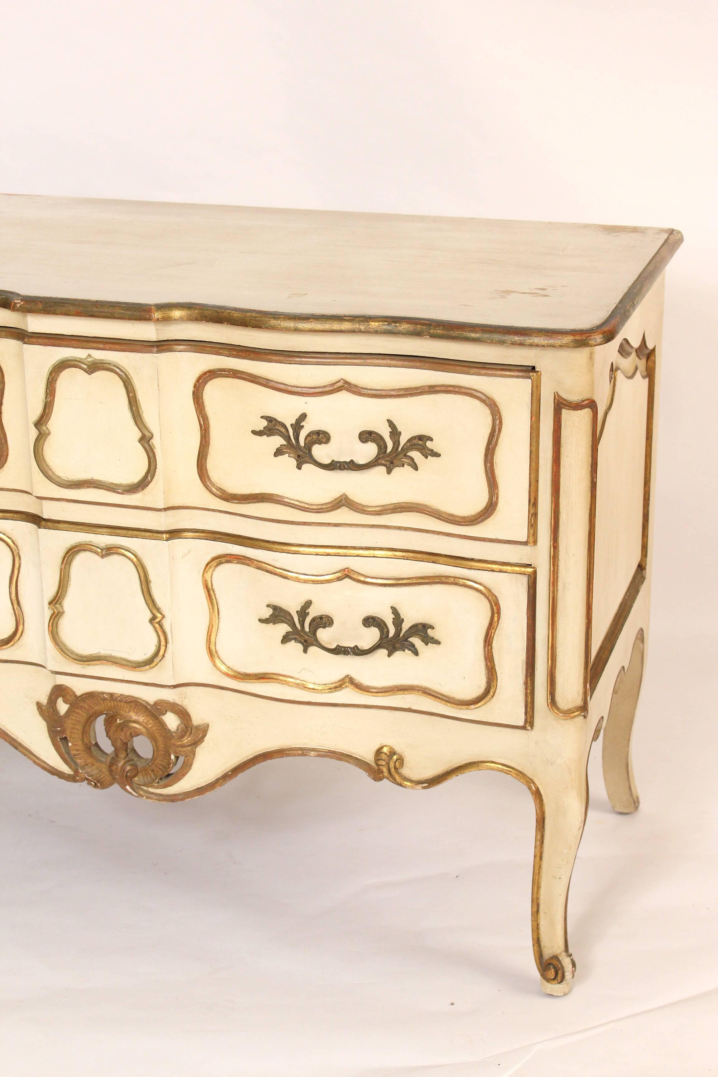 Painted Louis XV Provincial style chest of drawers, with nice quality gilt decoration, circa 1960. The drawers are hand dovetailed and made of solid oak. As can be seen in the photographs the top finish is rubbed.