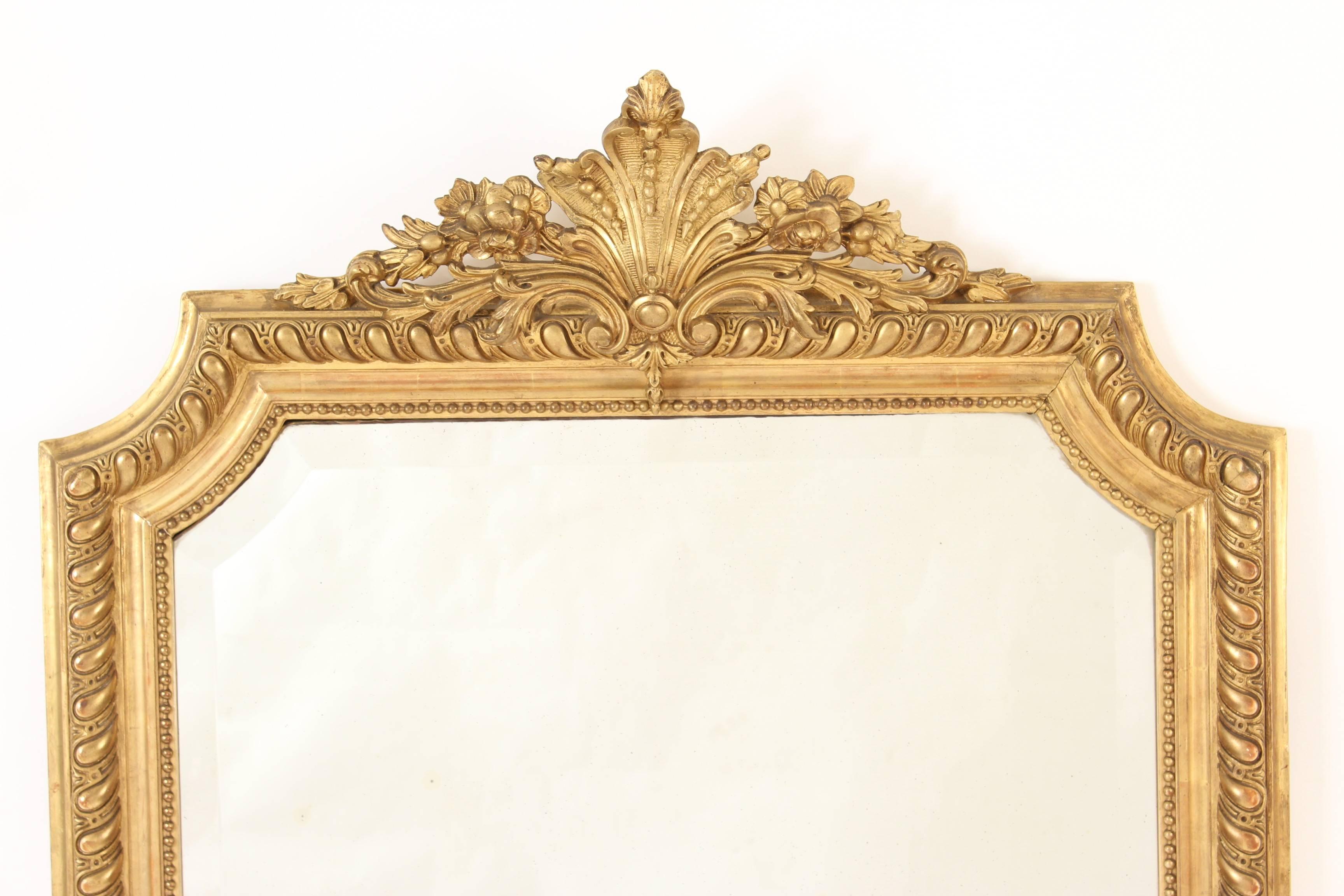 Louis XVI style gold leaf mirror with beveled glass, circa 1890-1910.