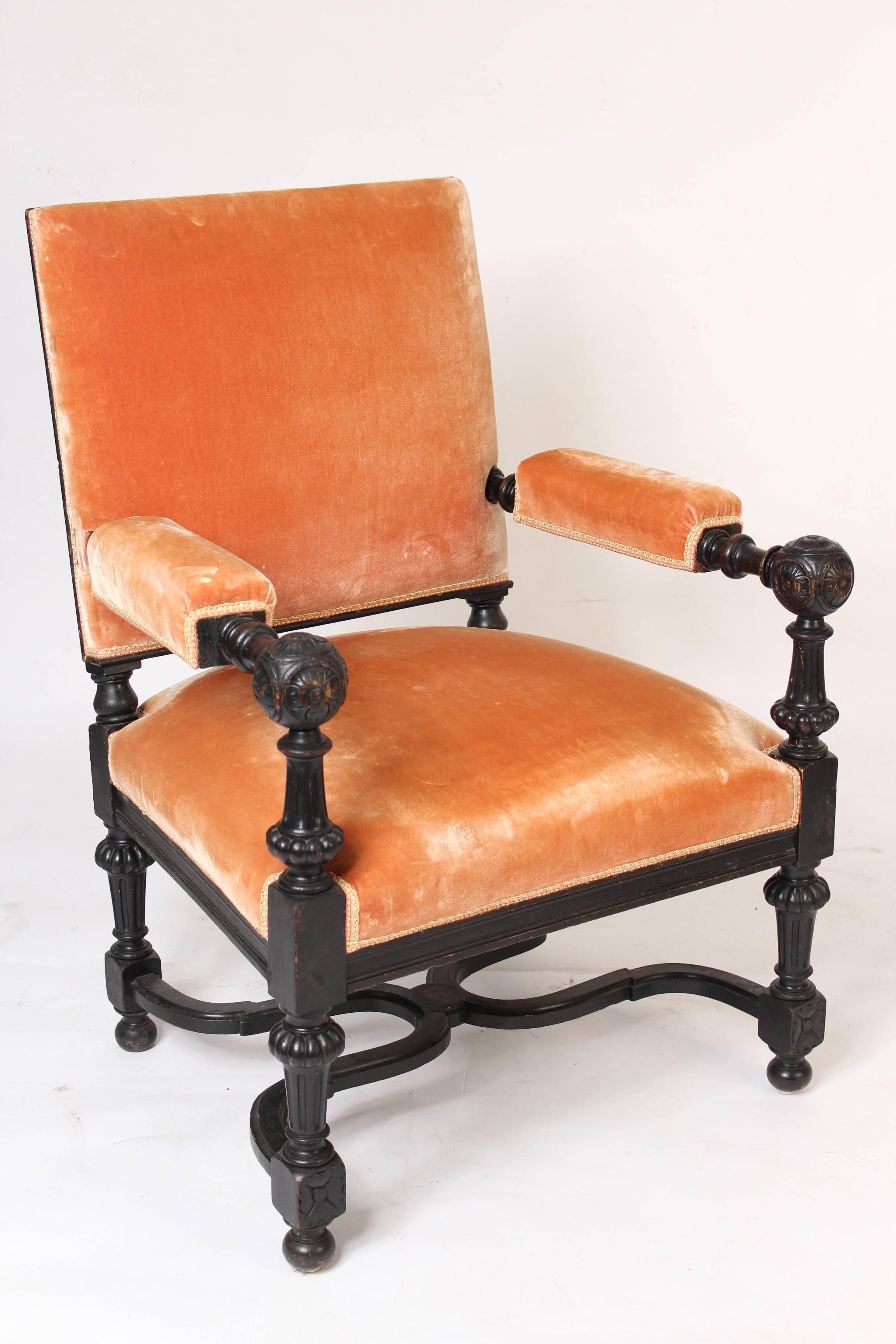 Pair of ebonized Napoleon III armchairs with arms terminating in balls, circa 1880.