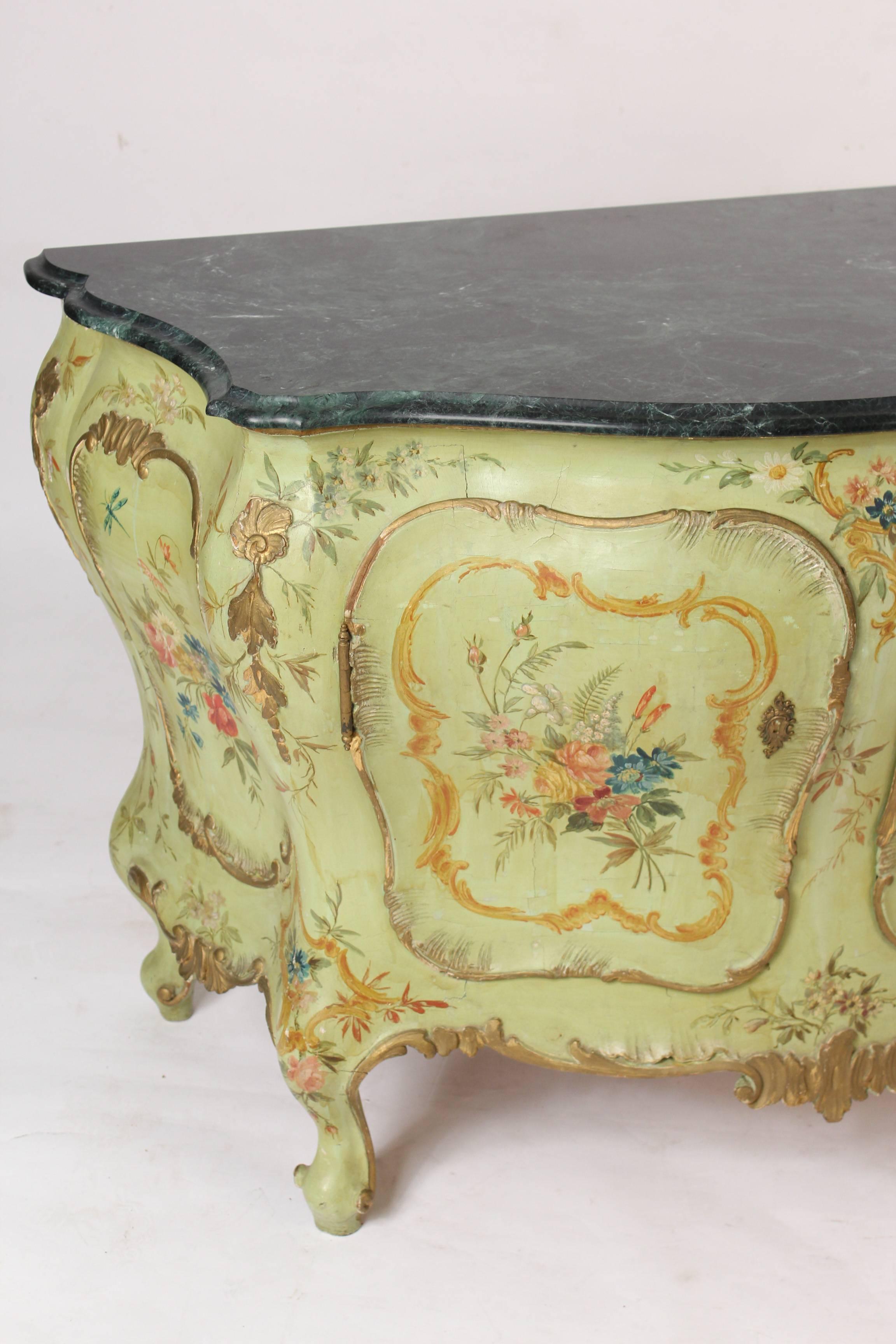 Italian Louis XV style painted bombe cabinet / commode with a marble top, circa 1950.
