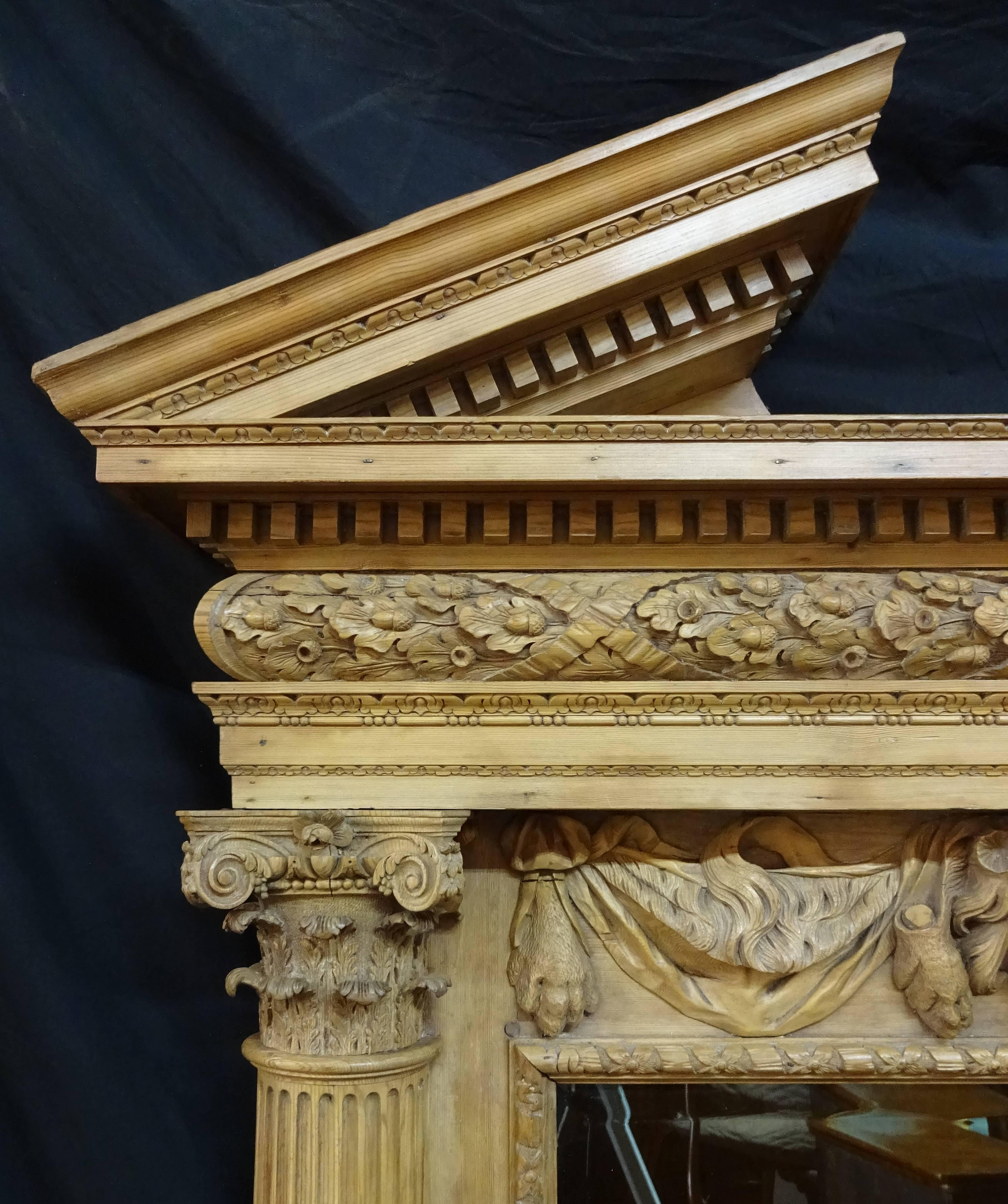 Attributed to Francis and John Booker after a design by William Jones.
The Palladian broken arch pediment with dentil carved molding above a cushion form frieze finely carved with acorn leaves; the original (re-silvered) beveled mirror plate set