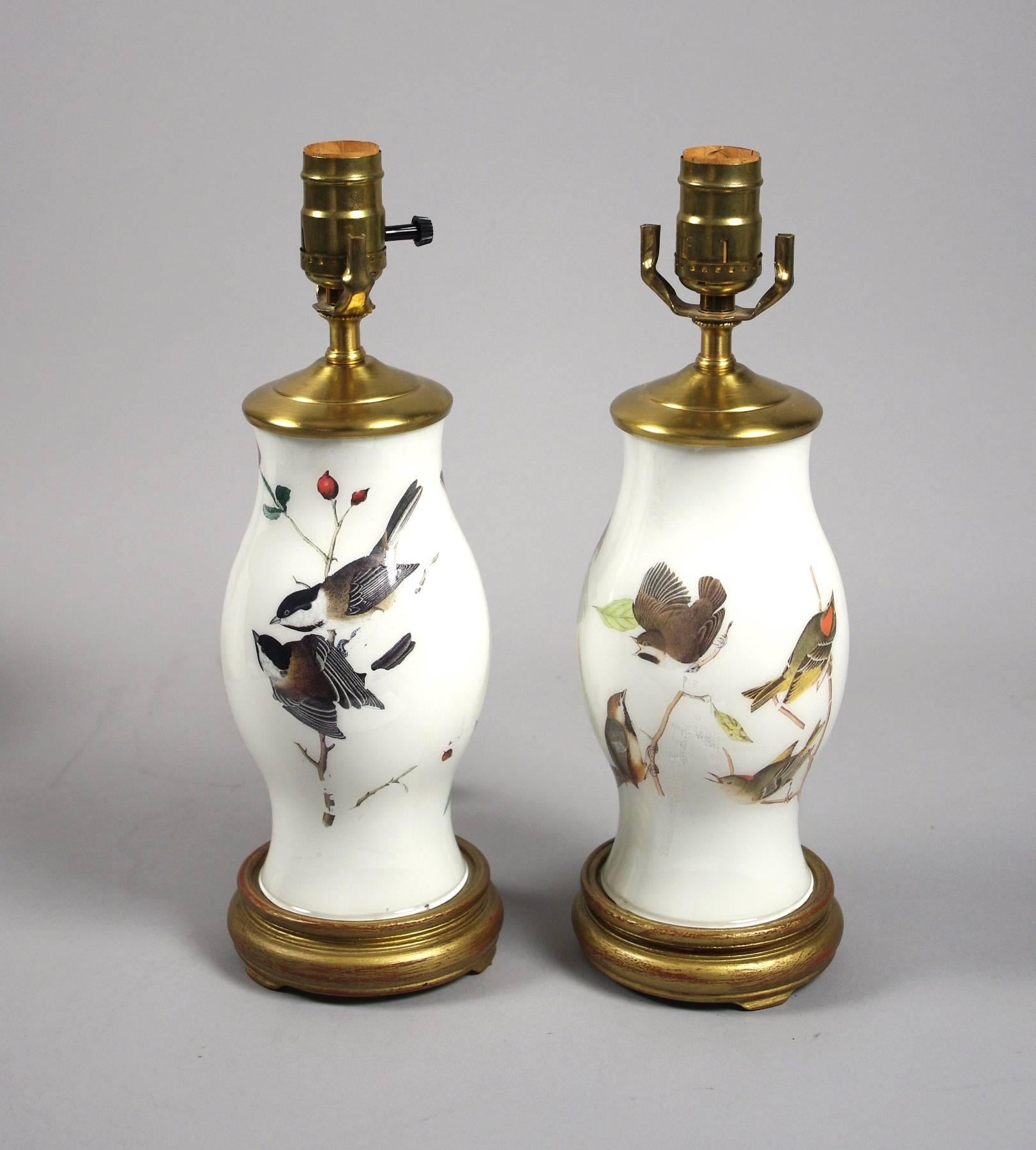Pair of decoupage lamps, each decorated with finches and other small birds, on a creamy white ground.
9.5 