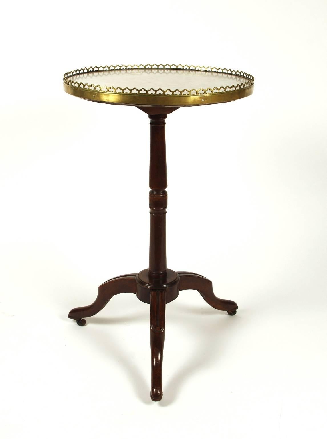 Directoire walnut Guéridon, the white marble top with a pierced brass gallery; the turned post supported by three cabriole legs with carved knees. Stamped J P Dusautoy (see photo).

There are a few small stains in the marble at about 9:00, visible